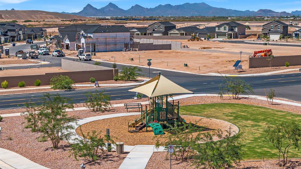 Welcome to The Madison at Blackhawk in Tucson, Arizona – the largest home in the community, offering an expansive 2,522 sq. ft. of living space designed for families seeking both luxury and functionality.  As you step through the inviting front porch, you're greeted by a thoughtfully designed entryway that leads into the heart of the home. The main level features a spacious great room that flows effortlessly into the dining area and the kitchen, making it an ideal space for entertaining and family gatherings. The kitchen is equipped with elegant granite countertops, a large island with a breakfast bar, modern appliances, and a pantry that provides ample storage, ensuring that the kitchen is as functional as it is stylish.  The main floor also includes a bedroom with easy access to a full bathroom, making it a perfect guest suite or a private home office. The convenient bathroom and direct access to the two-car garage enhance the home’s functionality, while the nearby utility room adds a layer of practicality to daily living.  Heading upstairs, you’ll find the family’s private quarters. The master suite is a true retreat, featuring a generously sized bedroom, a large walk-in closet, and an en-suite bathroom complete with dual vanities and a walk-in shower. The upper level also includes three additional bedrooms, a full bathroom, and a versatile loft area that can be tailored to fit your lifestyle, whether as a playroom, home office, or additional living space.  Back downstairs, step outside from the great room to the covered patio, where you can enjoy Tucson’s stunning weather year-round. Whether you’re hosting an outdoor gathering or simply relaxing after a long day, this space extends your living area and enhances the home’s inviting ambiance.  Designed with energy efficiency in mind, The Madison at Blackhawk is a DOE Zero Energy Ready Home, ensuring sustainability, comfort, and long-term savings.