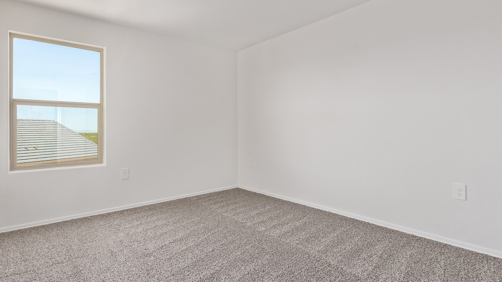 Welcome to The Madison at Blackhawk in Tucson, Arizona – the largest home in the community, offering an expansive 2,522 sq. ft. of living space designed for families seeking both luxury and functionality.  As you step through the inviting front porch, you're greeted by a thoughtfully designed entryway that leads into the heart of the home. The main level features a spacious great room that flows effortlessly into the dining area and the kitchen, making it an ideal space for entertaining and family gatherings. The kitchen is equipped with elegant granite countertops, a large island with a breakfast bar, modern appliances, and a pantry that provides ample storage, ensuring that the kitchen is as functional as it is stylish.  The main floor also includes a bedroom with easy access to a full bathroom, making it a perfect guest suite or a private home office. The convenient bathroom and direct access to the two-car garage enhance the home’s functionality, while the nearby utility room adds a layer of practicality to daily living.  Heading upstairs, you’ll find the family’s private quarters. The master suite is a true retreat, featuring a generously sized bedroom, a large walk-in closet, and an en-suite bathroom complete with dual vanities and a walk-in shower. The upper level also includes three additional bedrooms, a full bathroom, and a versatile loft area that can be tailored to fit your lifestyle, whether as a playroom, home office, or additional living space.  Back downstairs, step outside from the great room to the covered patio, where you can enjoy Tucson’s stunning weather year-round. Whether you’re hosting an outdoor gathering or simply relaxing after a long day, this space extends your living area and enhances the home’s inviting ambiance.  Designed with energy efficiency in mind, The Madison at Blackhawk is a DOE Zero Energy Ready Home, ensuring sustainability, comfort, and long-term savings.