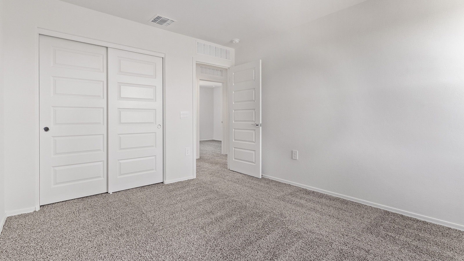 Welcome to The Madison at Blackhawk in Tucson, Arizona – the largest home in the community, offering an expansive 2,522 sq. ft. of living space designed for families seeking both luxury and functionality.  As you step through the inviting front porch, you're greeted by a thoughtfully designed entryway that leads into the heart of the home. The main level features a spacious great room that flows effortlessly into the dining area and the kitchen, making it an ideal space for entertaining and family gatherings. The kitchen is equipped with elegant granite countertops, a large island with a breakfast bar, modern appliances, and a pantry that provides ample storage, ensuring that the kitchen is as functional as it is stylish.  The main floor also includes a bedroom with easy access to a full bathroom, making it a perfect guest suite or a private home office. The convenient bathroom and direct access to the two-car garage enhance the home’s functionality, while the nearby utility room adds a layer of practicality to daily living.  Heading upstairs, you’ll find the family’s private quarters. The master suite is a true retreat, featuring a generously sized bedroom, a large walk-in closet, and an en-suite bathroom complete with dual vanities and a walk-in shower. The upper level also includes three additional bedrooms, a full bathroom, and a versatile loft area that can be tailored to fit your lifestyle, whether as a playroom, home office, or additional living space.  Back downstairs, step outside from the great room to the covered patio, where you can enjoy Tucson’s stunning weather year-round. Whether you’re hosting an outdoor gathering or simply relaxing after a long day, this space extends your living area and enhances the home’s inviting ambiance.  Designed with energy efficiency in mind, The Madison at Blackhawk is a DOE Zero Energy Ready Home, ensuring sustainability, comfort, and long-term savings.