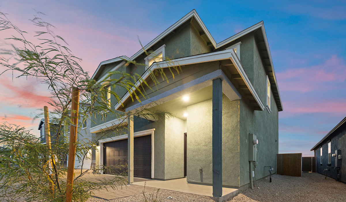 Introducing the Elm floor plan, a thoughtfully designed two-story home now available in the brand-new Redford Estates community in Southwest Tucson, Arizona. With 1,775 square feet of modern living space, the Elm is perfect for those seeking a cozy yet highly functional home that offers a smart separation between the private second-floor retreat and the main living areas below.  Step through the inviting front porch into a welcoming entryway that opens into the main first floor, designed to maximize every inch of space. The expansive great room flows into the dining area and kitchen, creating an ideal layout for entertaining and everyday living. The kitchen features a central island, quartz countertops, Shaker-style cabinetry, and walk-in pantry. A conveniently located powder room completes the first floor. This home features a finished two-car garage accessible from the main floor.  Upstairs, the Elm offers four spacious bedrooms each with a generous closet. The primary suite provides a peaceful retreat with a walk-in closet and en-suite bathroom. The three additional bedrooms are situated just off the versatile loft area, ideal for an extra living space, game room, or home office. Everyday convenience is built in, with the laundry room and a full secondary bathroom also located on the second floor.  Our homes at Redford Estates are designed with the future in mind. Each home features a Spanish lace stucco exterior, landscaped front yards with auto drip irrigation, and large backyards that are fully fenced and ready for your personal touch. Inside, the Home is Connected® Smart Home package brings modern convenience to your fingertips with a smart thermostat, video doorbell, keyless entry, and a Wi-Fi-enabled garage door opener.  Redford Estates is not just a place to live—it's a gateway to everything that makes Tucson unique. The Elm at Redford Estates combines comfort, style, and forward-thinking design, creating the perfect place to call home.