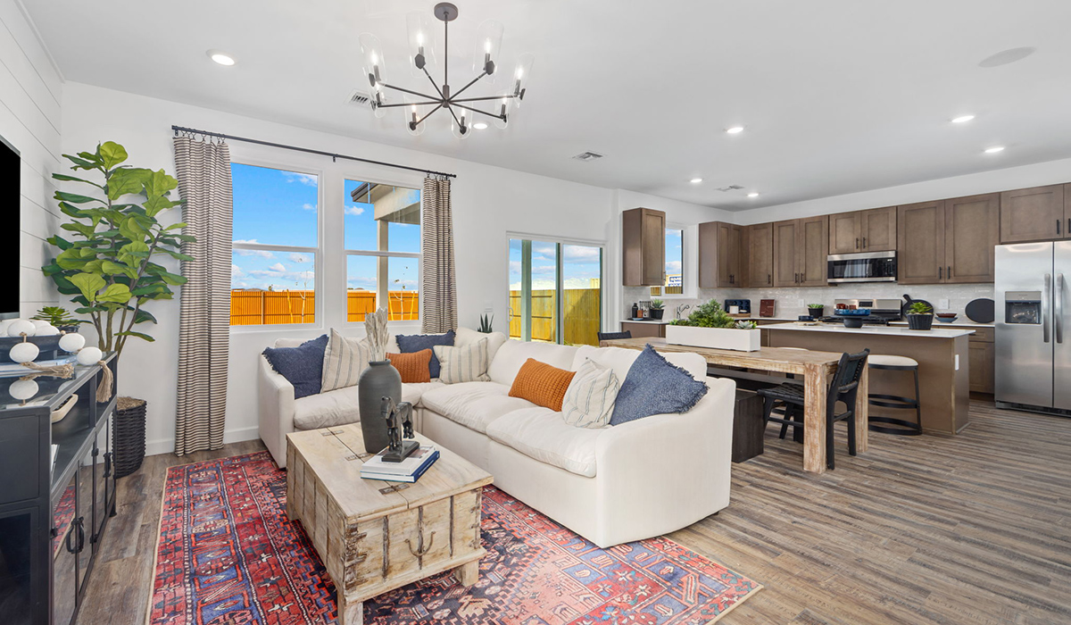 Discover the Gila — a versatile two-story floor plan offering 2,057 sq. ft. of comfortable, modern living in our new Redford Estate community of Southwest Tucson, Arizona.  Thoughtfully crafted for households of all sizes, the Gila features four bedrooms, a spacious loft, and three full bathrooms, ensuring every family member has their own space to unwind and recharge.  A standout highlight of this home is the guest-style suite on the main floor, offering convenient access to a full bathroom. Perfect for visitors, multigenerational living, or private home office, this main-level bedroom offers exceptional flexibility.  The main floor creates an inviting flow, with a generous great room that connects seamlessly to the dining area and kitchen. The kitchen features a large center island, Shaker-style cabinetry, and ample storage space to include a large pantry.  Upstairs, the Gila continues to impress with thoughtful design and family-friendly layout. The well-appointed primary bedroom includes a private en-suite bathroom and large walk-in closet. Bedrooms 2 and 3, along with the loft, share a full bathroom conveniently located for easy access. An additional standout feature is Bedroom 2, which includes a large walk-in closet—a perfect setup for teens, young adults, or anyone who appreciates extra storage and personal space. The second floor also features a large laundry room, conveniently located near the bedrooms.  Our homes at Redford Estates are designed with the future in mind. Each home features a Spanish lace stucco exterior, landscaped front yards with auto drip irrigation, and large backyards that are fully fenced and ready for your personal touch. Inside, the Home is Connected® Smart Home package brings modern convenience to your fingertips with a smart thermostat, video doorbell, keyless entry, and a Wi-Fi-enabled garage door opener.  With three full bathrooms, smartly arranged bedrooms, and spaces crafted for comfort and flexibility, the Gila is designed to meet the needs of today's busy and evolving lifestyles.