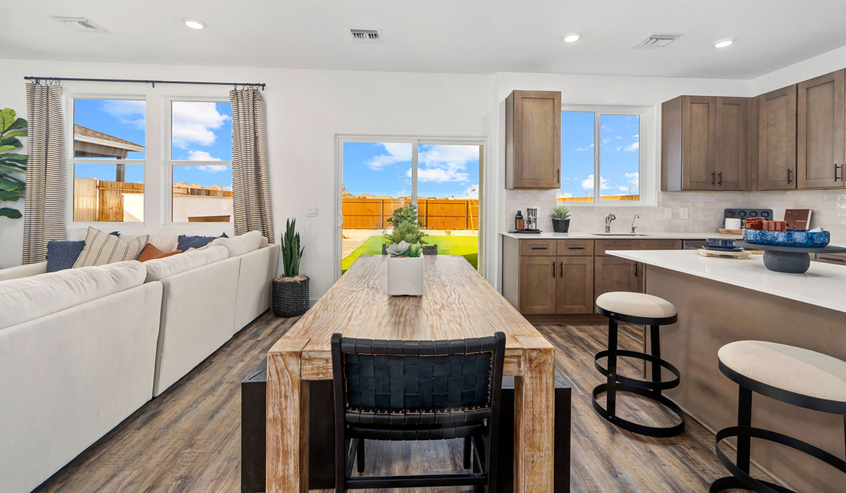 Discover the Gila — a versatile two-story floor plan offering 2,057 sq. ft. of comfortable, modern living in our new Redford Estate community of Southwest Tucson, Arizona.  Thoughtfully crafted for households of all sizes, the Gila features four bedrooms, a spacious loft, and three full bathrooms, ensuring every family member has their own space to unwind and recharge.  A standout highlight of this home is the guest-style suite on the main floor, offering convenient access to a full bathroom. Perfect for visitors, multigenerational living, or private home office, this main-level bedroom offers exceptional flexibility.  The main floor creates an inviting flow, with a generous great room that connects seamlessly to the dining area and kitchen. The kitchen features a large center island, Shaker-style cabinetry, and ample storage space to include a large pantry.  Upstairs, the Gila continues to impress with thoughtful design and family-friendly layout. The well-appointed primary bedroom includes a private en-suite bathroom and large walk-in closet. Bedrooms 2 and 3, along with the loft, share a full bathroom conveniently located for easy access. An additional standout feature is Bedroom 2, which includes a large walk-in closet—a perfect setup for teens, young adults, or anyone who appreciates extra storage and personal space. The second floor also features a large laundry room, conveniently located near the bedrooms.  Our homes at Redford Estates are designed with the future in mind. Each home features a Spanish lace stucco exterior, landscaped front yards with auto drip irrigation, and large backyards that are fully fenced and ready for your personal touch. Inside, the Home is Connected® Smart Home package brings modern convenience to your fingertips with a smart thermostat, video doorbell, keyless entry, and a Wi-Fi-enabled garage door opener.  With three full bathrooms, smartly arranged bedrooms, and spaces crafted for comfort and flexibility, the Gila is designed to meet the needs of today's busy and evolving lifestyles.