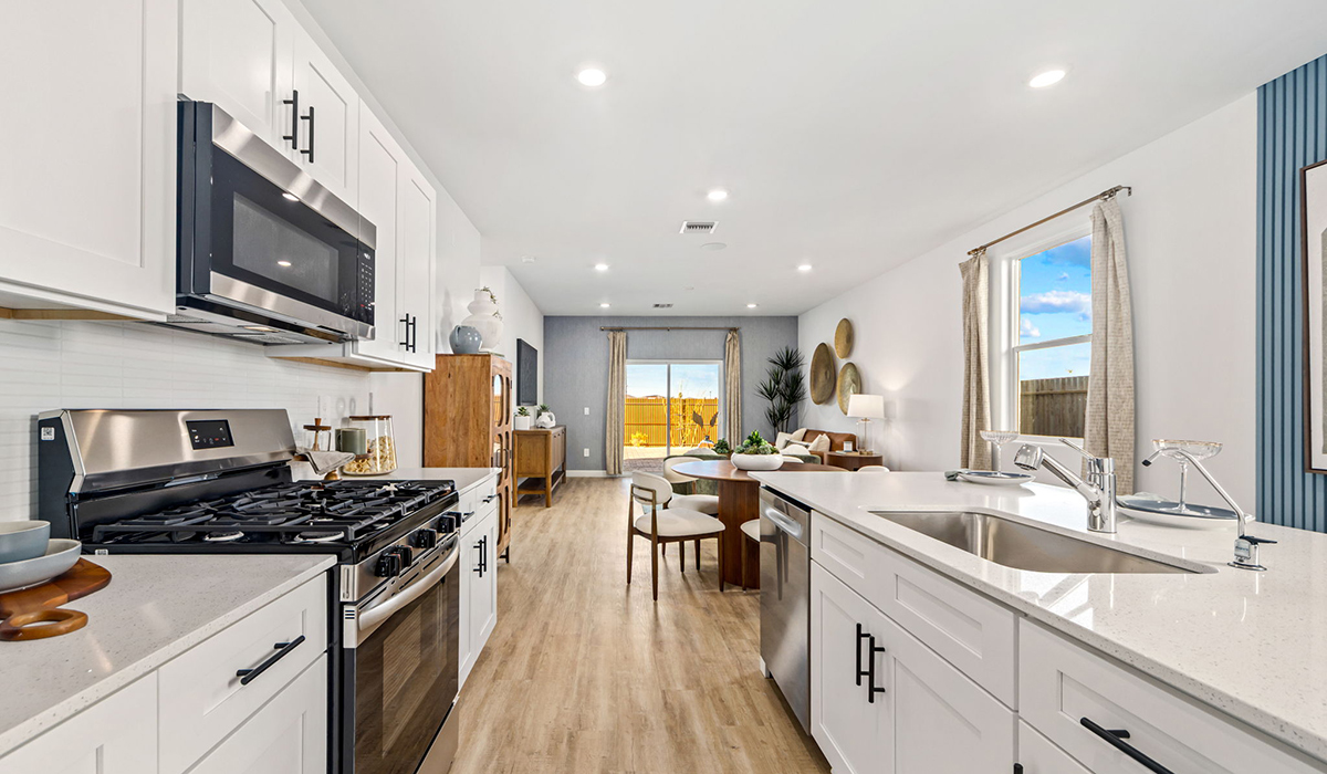 Introducing the Carolina — a thoughtfully designed single-story home offering 1,536 sq. ft. of modern comfort at Redford Estates in Southwest Tucson, Arizona.  With three bedrooms, two full bathrooms, and a two-car garage, this efficient and beautifully planned layout is perfect for those seeking convenience, comfort, and single-level living.  A welcoming front porch invites you inside, where the entryway opens into a bright and beautifully crafted living space. The heart of the home is the well-appointed kitchen, featuring a large center island, walk-in pantry, and stylish Shaker-style cabinetry.  Overlooking the dining area and great room, this open layout makes it easy to cook, gather, and entertain with ease.  The primary bedroom is thoughtfully positioned at the rear of the home, creating a private retreat. Complete with a large en-suite bathroom and walk-in closet, it's designed for relaxation and convenience.  Two additional bedrooms are located toward the front of the home, offering flexibility for family, guests, a home office, or hobbies, and share a full secondary hallway bathroom.  Our homes at Redford Estates are designed with the future in mind. Each home features a Spanish lace stucco exterior, landscaped front yards with auto drip irrigation, and large backyards that are fully fenced and ready for your personal touch. Inside, the Home is Connected® Smart Home package brings modern convenience to your fingertips with a smart thermostat, video doorbell, keyless entry, and a Wi-Fi-enabled garage door opener.  With its smart layout, modern features, and effortless single-story living, the Carolina brings comfort and functionality together in a one beautifully designed home here at Redford Estates.  *Images shown are for reference only. They depict the Carolina model home and may not represent the actual home.