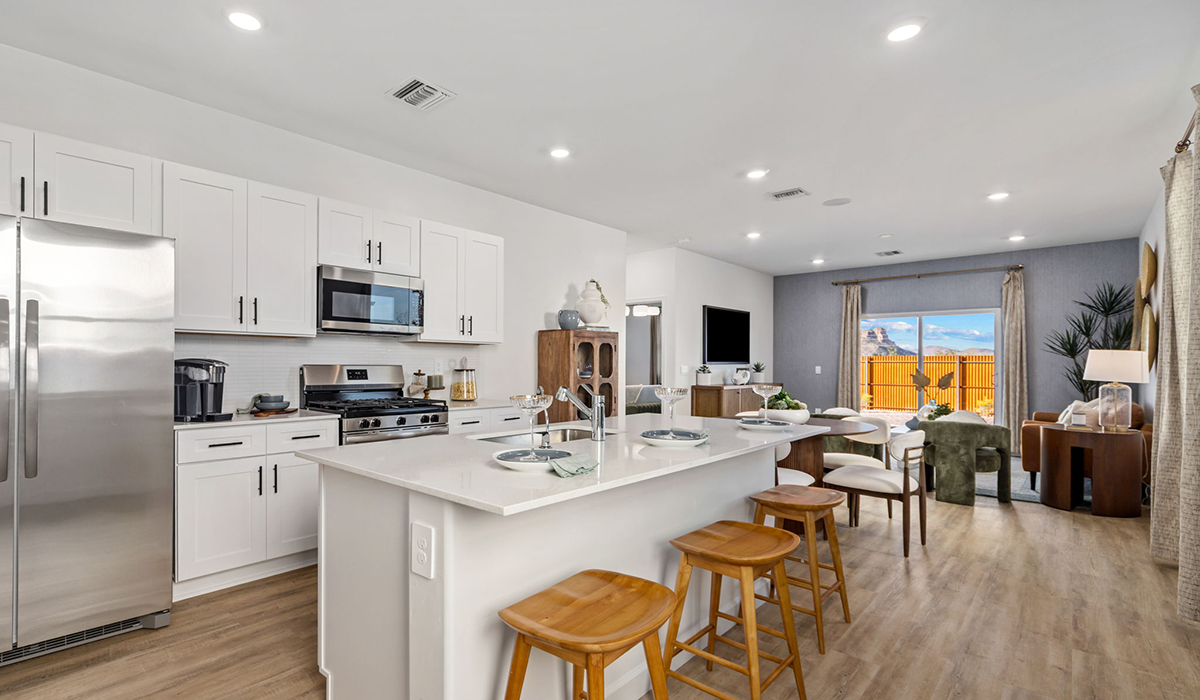 Introducing the Carolina — a thoughtfully designed single-story home offering 1,536 sq. ft. of modern comfort at Redford Estates in Southwest Tucson, Arizona.  With three bedrooms, two full bathrooms, and a two-car garage, this efficient and beautifully planned layout is perfect for those seeking convenience, comfort, and single-level living.  A welcoming front porch invites you inside, where the entryway opens into a bright and beautifully crafted living space. The heart of the home is the well-appointed kitchen, featuring a large center island, walk-in pantry, and stylish Shaker-style cabinetry.  Overlooking the dining area and great room, this open layout makes it easy to cook, gather, and entertain with ease.  The primary bedroom is thoughtfully positioned at the rear of the home, creating a private retreat. Complete with a large en-suite bathroom and walk-in closet, it's designed for relaxation and convenience.  Two additional bedrooms are located toward the front of the home, offering flexibility for family, guests, a home office, or hobbies, and share a full secondary hallway bathroom.  Our homes at Redford Estates are designed with the future in mind. Each home features a Spanish lace stucco exterior, landscaped front yards with auto drip irrigation, and large backyards that are fully fenced and ready for your personal touch. Inside, the Home is Connected® Smart Home package brings modern convenience to your fingertips with a smart thermostat, video doorbell, keyless entry, and a Wi-Fi-enabled garage door opener.  With its smart layout, modern features, and effortless single-story living, the Carolina brings comfort and functionality together in a one beautifully designed home here at Redford Estates.  *Images shown are for reference only. They depict the Carolina model home and may not represent the actual home.