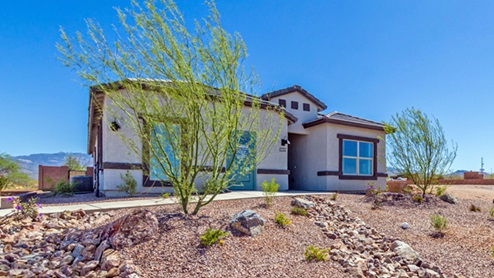 Welcome to The Oasis at Rocking K, a premier D.R. Horton new home community nestled in the picturesque landscapes of Vail, Arizona, where new homes blend seamlessly with the breathtaking surroundings of the Rincon Mountains. Experience the perfect balance of tranquility and modern convenience in this master-planned neighborhood, designed to offer a lifestyle that caters to families, nature enthusiasts, and anyone seeking a peaceful yet connected community. The Oasis at Rocking K features five beautifully designed one-story floor plans ranging from 1,400 to 1,900 square feet, each crafted with the high-quality features and finishes D.R. Horton is known for. Homes in Rocking K feature a Spanish lace stucco exterior, tile roofs, and meticulously landscaped front yards with auto drip irrigation. Inside, you’ll find luxurious quartz countertops in the kitchens and bathrooms, 42” shaker-style cabinets with modern cabinet pulls, and wood-look tile flooring throughout the main living areas. Homes also include covered front porches and back patios, perfect for enjoying Arizona’s stunning sunsets and clear night skies. Each home in The Oasis at Rocking K is equipped with D.R. Horton’s Home is Connected® Smart Home package, which includes a smart thermostat, video doorbell, keyless entry, Wi-Fi-enabled garage door opener, and Deako light switches. Additionally, these homes meet the stringent DOE Zero Energy Ready Home standards, making them not only comfortable and modern but also exceptionally energy-efficient. With features like spray foam insulation, tankless water heaters and LED lighting, these homes are designed to reduce your environmental footprint and provide long-term savings on energy costs. Living at Rocking K means being part of a vibrant, family-oriented community with a strong sense of connection among residents. The Oasis at Rocking K offers a variety of amenities, including ramadas, picnic tables, and grassy areas perfect for gatherings. Residents also have access to the greater Rocking K master-planned neighborhood amenities, such as a splashpad, large event lawn, walking paths, multipurpose fields, basketball and pickleball courts, and an innovative playground with a zip-line and jungle gym. The new K-8 school, set to open in 2025, is just one of the many features that make Rocking K ideal for families. Life at Rocking K is further enriched by a lively calendar of lifestyle events, thoughtfully organized by the Rocking K Homeowners Association. These events are a cornerstone of community life, fostering a strong sense of connection among residents. Whether you’re looking to enjoy a quiet evening star gazing in the park or engage in fun activities with neighbors, there’s always something happening. The quarterly lifestyle calendar is packed with regular and seasonal events, including movie nights in the park, sports and summer camps for kids, and wine tasting events for adults. Families can join hiking groups, participate in trivia nights, or enjoy the various holiday celebrations. The community comes alive during the holidays with loads of themed events, arts and crafts fairs, and car shows. Rocking K’s commitment to providing a dynamic and engaging environment ensures that there’s always an opportunity to make memories and build lasting friendships right in your neighborhood. Residents of Rocking K benefit from easy access to I-10, making commutes to Tucson and surrounding areas a breeze. The community is close to major employers such as Davis-Monthan Air Force Base, Raytheon, and the University of Arizona, as well as top-notch healthcare facilities like TMC Rincon and Northwest Hospital East. The nearby Houghton Town Center and Houghton Rd. business corridor offer convenient shopping, dining, and services. For outdoor enthusiasts, Rocking K is surrounded by natural beauty and recreational opportunities. Explore the hiking and biking trails at Colossal Cave Mountain Park, Saguaro National Park East, and the Arizona Trail. Enjoy golfing at Del Lago Golf Course, or take a short drive to Sonoita for a day trip to Arizona’s Wine Country. Whether it’s hiking, camping, or simply taking in the stunning views, Rocking K is your gateway to the great outdoors. With 360-degree mountain views, calm and quiet evenings, and a location that’s close to everything you need, Rocking K is truly a community where you can thrive. Experience the best of Arizona living at The Oasis at Rocking K, where your new home awaits in a community that offers everything you need for a fulfilling lifestyle.
