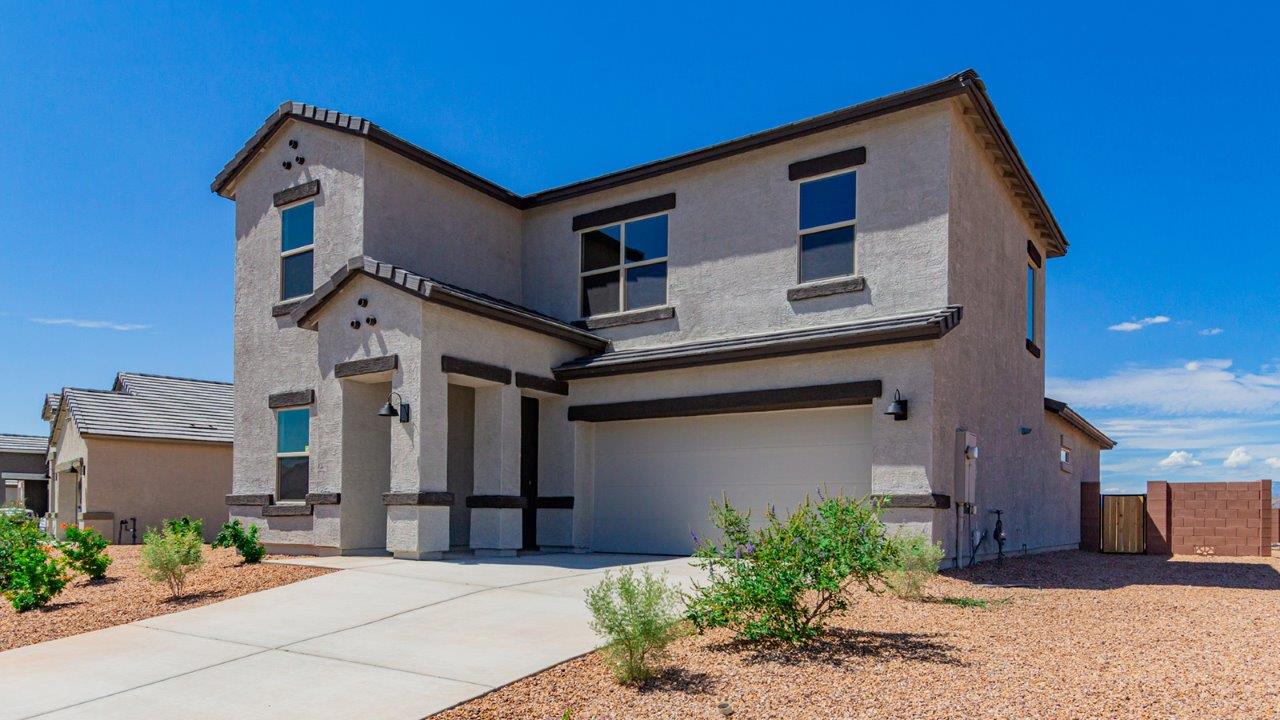 Introducing The River plan at The Oasis at Rocking K, a standout two-story new home that epitomizes spacious living and modern amenities in the scenic backdrop of Vail, Arizona. Nestled within this master-planned community, The River offers an impressive 2,396 square feet of living space, making it the largest floorplan available at The Oasis. This home is intentionally designed to accommodate the needs of growing families, with five bedrooms and three bathrooms, ensuring plenty of space for everyone.  The exterior of The River plan exudes charm and character, with its Spanish lace stucco finish and tile roof that blends seamlessly into the picturesque surroundings. The home’s front yard is meticulously landscaped with auto drip irrigation, providing a welcoming entrance to this beautiful residence.  Upon entering The River, you'll be greeted by a bright and inviting great room that flows effortlessly into the dining room and kitchen, creating a harmonious space perfect for entertaining or family gatherings. The kitchen is a chef’s day dream, featuring quartz countertops, 42” shaker-style cabinets, and stainless steel appliances, all designed to inspire culinary creativity. The main floor also includes the luxurious owner’s suite, which serves as a private sanctuary. This suite features a spacious walk-in closet and an en-suite bathroom with dual vanities, a walk-in shower, and a soaking tub, providing the perfect retreat at the end of the day. Additionally, a second bedroom on the main floor offers flexibility, ideal for guests or a home office.  As you ascend to the second story, you'll find three additional bedrooms, all with easy access to a full bathroom. A generous loft area on the second floor offers additional living space, ideal for a media room, play area, or home gym.  The River plan is not just about style and space; it’s also about modern convenience and energy efficiency. The home is equipped with D.R. Horton’s Home is Connected® Smart Home package, which includes a smart thermostat, video doorbell, keyless entry, Wi-Fi-enabled garage door opener, and Deako light switches, ensuring that your home is as functional as it is beautiful. Additionally, the home meets the DOE Zero Energy Ready Home standards, featuring energy-efficient elements such as spray foam insulation, a tankless water heater, LED lighting throughout and more.  Living at The Oasis at Rocking K means more than just owning a home; it means being part of a vibrant community. With access to amenities like ramadas, picnic areas, walking paths, and recreational fields, plus the greater Rocking K master-planned neighborhood’s splashpad, event lawn, playground, and events, there’s always something to do. Residents also enjoy the convenience of nearby schools, shopping, dining, and outdoor recreational opportunities, making The Oasis at Rocking K the perfect place to call home.  The River plan at The Oasis at Rocking K is where space, style, and smart living converge, offering a home designed for the way you live today.