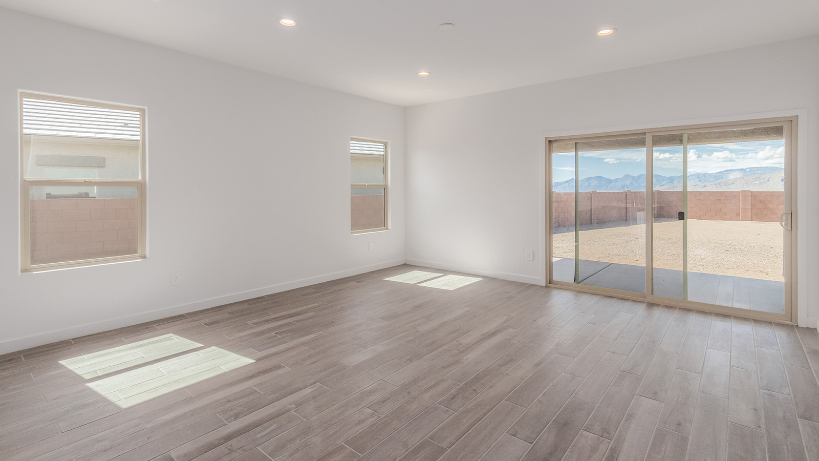 Introducing The River plan at The Oasis at Rocking K, a standout two-story new home that epitomizes spacious living and modern amenities in the scenic backdrop of Vail, Arizona. Nestled within this master-planned community, The River offers an impressive 2,396 square feet of living space, making it the largest floorplan available at The Oasis. This home is intentionally designed to accommodate the needs of growing families, with five bedrooms and three bathrooms, ensuring plenty of space for everyone.  The exterior of The River plan exudes charm and character, with its Spanish lace stucco finish and tile roof that blends seamlessly into the picturesque surroundings. The home’s front yard is meticulously landscaped with auto drip irrigation, providing a welcoming entrance to this beautiful residence.  Upon entering The River, you'll be greeted by a bright and inviting great room that flows effortlessly into the dining room and kitchen, creating a harmonious space perfect for entertaining or family gatherings. The kitchen is a chef’s day dream, featuring quartz countertops, 42” shaker-style cabinets, and stainless steel appliances, all designed to inspire culinary creativity. The main floor also includes the luxurious owner’s suite, which serves as a private sanctuary. This suite features a spacious walk-in closet and an en-suite bathroom with dual vanities, a walk-in shower, and a soaking tub, providing the perfect retreat at the end of the day. Additionally, a second bedroom on the main floor offers flexibility, ideal for guests or a home office.  As you ascend to the second story, you'll find three additional bedrooms, all with easy access to a full bathroom. A generous loft area on the second floor offers additional living space, ideal for a media room, play area, or home gym.  The River plan is not just about style and space; it’s also about modern convenience and energy efficiency. The home is equipped with D.R. Horton’s Home is Connected® Smart Home package, which includes a smart thermostat, video doorbell, keyless entry, Wi-Fi-enabled garage door opener, and Deako light switches, ensuring that your home is as functional as it is beautiful. Additionally, the home meets the DOE Zero Energy Ready Home standards, featuring energy-efficient elements such as spray foam insulation, a tankless water heater, LED lighting throughout and more.  Living at The Oasis at Rocking K means more than just owning a home; it means being part of a vibrant community. With access to amenities like ramadas, picnic areas, walking paths, and recreational fields, plus the greater Rocking K master-planned neighborhood’s splashpad, event lawn, playground, and events, there’s always something to do. Residents also enjoy the convenience of nearby schools, shopping, dining, and outdoor recreational opportunities, making The Oasis at Rocking K the perfect place to call home.  The River plan at The Oasis at Rocking K is where space, style, and smart living converge, offering a home designed for the way you live today.