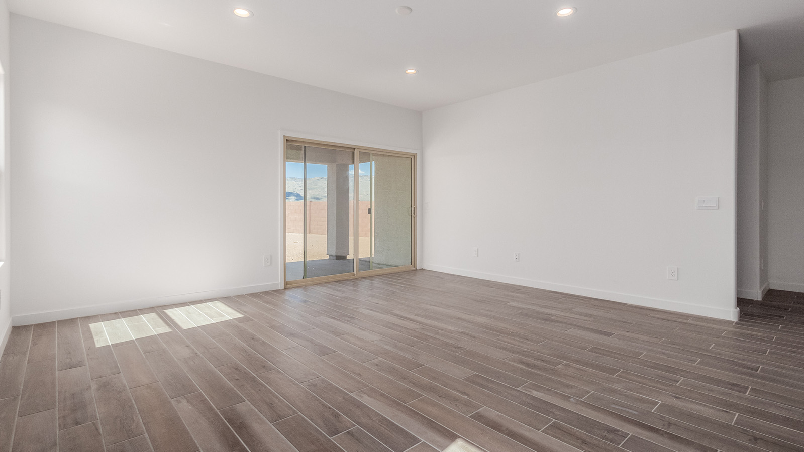 Introducing The River plan at The Oasis at Rocking K, a standout two-story new home that epitomizes spacious living and modern amenities in the scenic backdrop of Vail, Arizona. Nestled within this master-planned community, The River offers an impressive 2,396 square feet of living space, making it the largest floorplan available at The Oasis. This home is intentionally designed to accommodate the needs of growing families, with five bedrooms and three bathrooms, ensuring plenty of space for everyone.  The exterior of The River plan exudes charm and character, with its Spanish lace stucco finish and tile roof that blends seamlessly into the picturesque surroundings. The home’s front yard is meticulously landscaped with auto drip irrigation, providing a welcoming entrance to this beautiful residence.  Upon entering The River, you'll be greeted by a bright and inviting great room that flows effortlessly into the dining room and kitchen, creating a harmonious space perfect for entertaining or family gatherings. The kitchen is a chef’s day dream, featuring quartz countertops, 42” shaker-style cabinets, and stainless steel appliances, all designed to inspire culinary creativity. The main floor also includes the luxurious owner’s suite, which serves as a private sanctuary. This suite features a spacious walk-in closet and an en-suite bathroom with dual vanities, a walk-in shower, and a soaking tub, providing the perfect retreat at the end of the day. Additionally, a second bedroom on the main floor offers flexibility, ideal for guests or a home office.  As you ascend to the second story, you'll find three additional bedrooms, all with easy access to a full bathroom. A generous loft area on the second floor offers additional living space, ideal for a media room, play area, or home gym.  The River plan is not just about style and space; it’s also about modern convenience and energy efficiency. The home is equipped with D.R. Horton’s Home is Connected® Smart Home package, which includes a smart thermostat, video doorbell, keyless entry, Wi-Fi-enabled garage door opener, and Deako light switches, ensuring that your home is as functional as it is beautiful. Additionally, the home meets the DOE Zero Energy Ready Home standards, featuring energy-efficient elements such as spray foam insulation, a tankless water heater, LED lighting throughout and more.  Living at The Oasis at Rocking K means more than just owning a home; it means being part of a vibrant community. With access to amenities like ramadas, picnic areas, walking paths, and recreational fields, plus the greater Rocking K master-planned neighborhood’s splashpad, event lawn, playground, and events, there’s always something to do. Residents also enjoy the convenience of nearby schools, shopping, dining, and outdoor recreational opportunities, making The Oasis at Rocking K the perfect place to call home.  The River plan at The Oasis at Rocking K is where space, style, and smart living converge, offering a home designed for the way you live today.