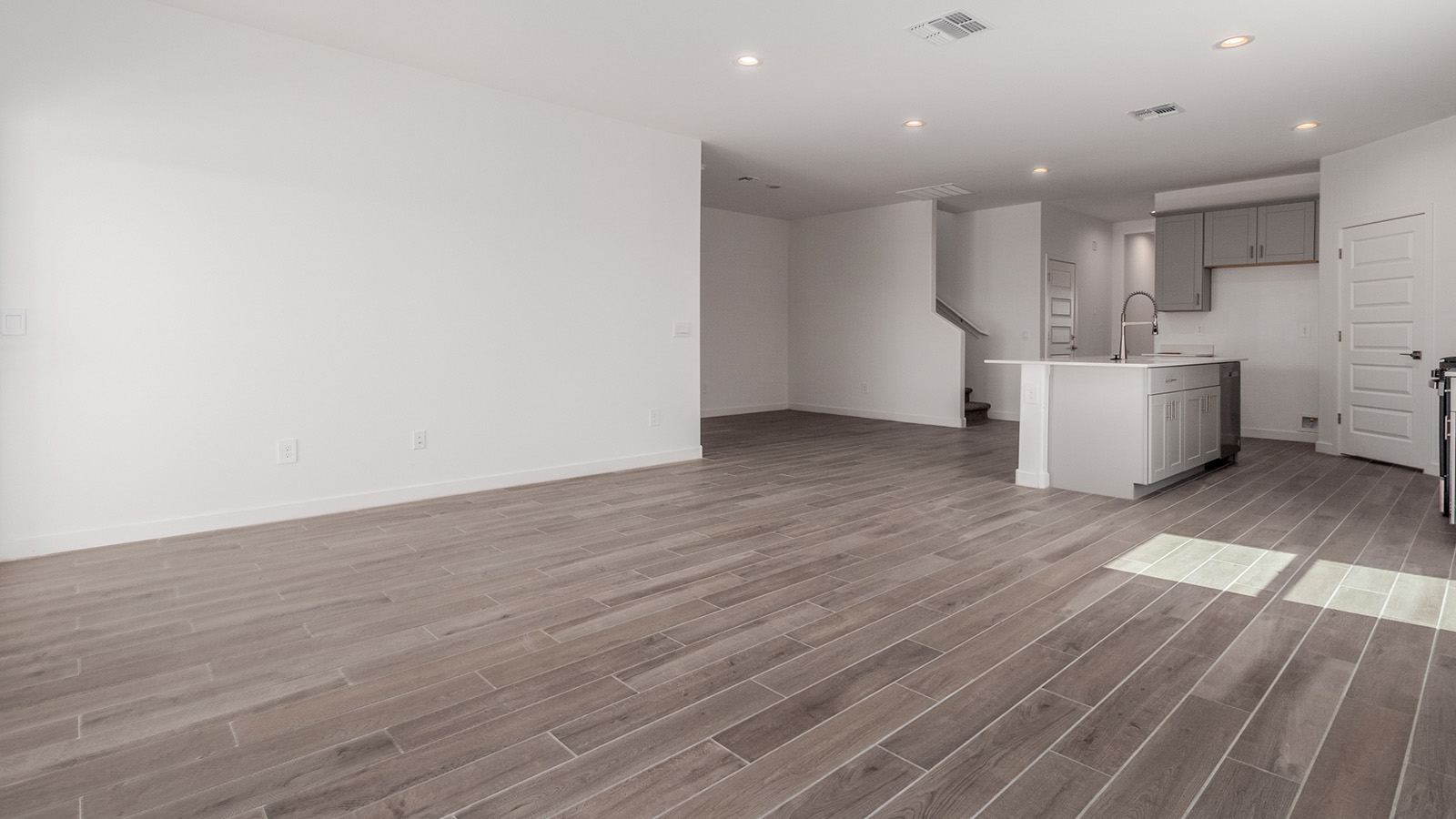 Introducing The River plan at The Oasis at Rocking K, a standout two-story new home that epitomizes spacious living and modern amenities in the scenic backdrop of Vail, Arizona. Nestled within this master-planned community, The River offers an impressive 2,396 square feet of living space, making it the largest floorplan available at The Oasis. This home is intentionally designed to accommodate the needs of growing families, with five bedrooms and three bathrooms, ensuring plenty of space for everyone.  The exterior of The River plan exudes charm and character, with its Spanish lace stucco finish and tile roof that blends seamlessly into the picturesque surroundings. The home’s front yard is meticulously landscaped with auto drip irrigation, providing a welcoming entrance to this beautiful residence.  Upon entering The River, you'll be greeted by a bright and inviting great room that flows effortlessly into the dining room and kitchen, creating a harmonious space perfect for entertaining or family gatherings. The kitchen is a chef’s day dream, featuring quartz countertops, 42” shaker-style cabinets, and stainless steel appliances, all designed to inspire culinary creativity. The main floor also includes the luxurious owner’s suite, which serves as a private sanctuary. This suite features a spacious walk-in closet and an en-suite bathroom with dual vanities, a walk-in shower, and a soaking tub, providing the perfect retreat at the end of the day. Additionally, a second bedroom on the main floor offers flexibility, ideal for guests or a home office.  As you ascend to the second story, you'll find three additional bedrooms, all with easy access to a full bathroom. A generous loft area on the second floor offers additional living space, ideal for a media room, play area, or home gym.  The River plan is not just about style and space; it’s also about modern convenience and energy efficiency. The home is equipped with D.R. Horton’s Home is Connected® Smart Home package, which includes a smart thermostat, video doorbell, keyless entry, Wi-Fi-enabled garage door opener, and Deako light switches, ensuring that your home is as functional as it is beautiful. Additionally, the home meets the DOE Zero Energy Ready Home standards, featuring energy-efficient elements such as spray foam insulation, a tankless water heater, LED lighting throughout and more.  Living at The Oasis at Rocking K means more than just owning a home; it means being part of a vibrant community. With access to amenities like ramadas, picnic areas, walking paths, and recreational fields, plus the greater Rocking K master-planned neighborhood’s splashpad, event lawn, playground, and events, there’s always something to do. Residents also enjoy the convenience of nearby schools, shopping, dining, and outdoor recreational opportunities, making The Oasis at Rocking K the perfect place to call home.  The River plan at The Oasis at Rocking K is where space, style, and smart living converge, offering a home designed for the way you live today.