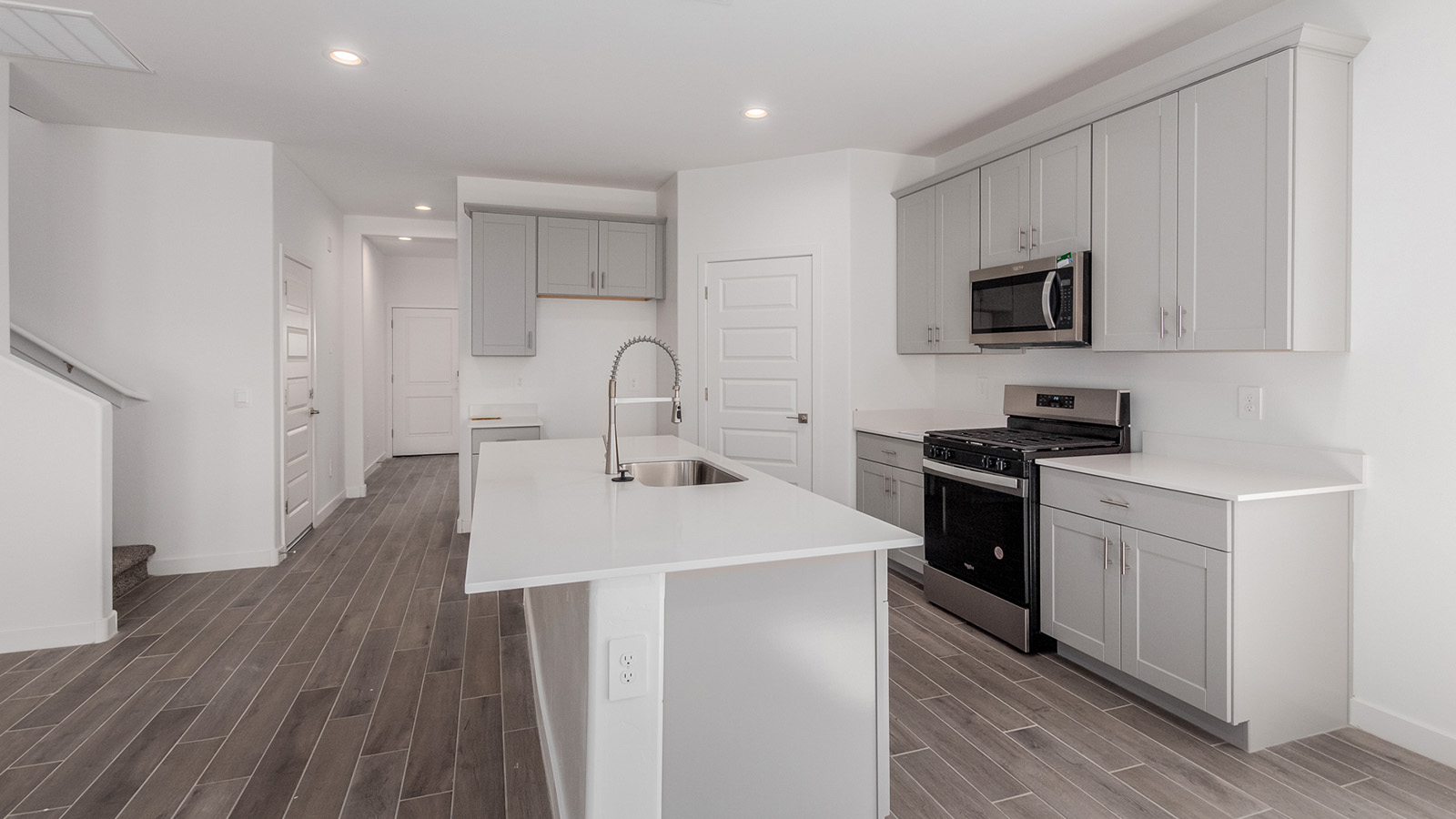 Introducing The River plan at The Oasis at Rocking K, a standout two-story new home that epitomizes spacious living and modern amenities in the scenic backdrop of Vail, Arizona. Nestled within this master-planned community, The River offers an impressive 2,396 square feet of living space, making it the largest floorplan available at The Oasis. This home is intentionally designed to accommodate the needs of growing families, with five bedrooms and three bathrooms, ensuring plenty of space for everyone.  The exterior of The River plan exudes charm and character, with its Spanish lace stucco finish and tile roof that blends seamlessly into the picturesque surroundings. The home’s front yard is meticulously landscaped with auto drip irrigation, providing a welcoming entrance to this beautiful residence.  Upon entering The River, you'll be greeted by a bright and inviting great room that flows effortlessly into the dining room and kitchen, creating a harmonious space perfect for entertaining or family gatherings. The kitchen is a chef’s day dream, featuring quartz countertops, 42” shaker-style cabinets, and stainless steel appliances, all designed to inspire culinary creativity. The main floor also includes the luxurious owner’s suite, which serves as a private sanctuary. This suite features a spacious walk-in closet and an en-suite bathroom with dual vanities, a walk-in shower, and a soaking tub, providing the perfect retreat at the end of the day. Additionally, a second bedroom on the main floor offers flexibility, ideal for guests or a home office.  As you ascend to the second story, you'll find three additional bedrooms, all with easy access to a full bathroom. A generous loft area on the second floor offers additional living space, ideal for a media room, play area, or home gym.  The River plan is not just about style and space; it’s also about modern convenience and energy efficiency. The home is equipped with D.R. Horton’s Home is Connected® Smart Home package, which includes a smart thermostat, video doorbell, keyless entry, Wi-Fi-enabled garage door opener, and Deako light switches, ensuring that your home is as functional as it is beautiful. Additionally, the home meets the DOE Zero Energy Ready Home standards, featuring energy-efficient elements such as spray foam insulation, a tankless water heater, LED lighting throughout and more.  Living at The Oasis at Rocking K means more than just owning a home; it means being part of a vibrant community. With access to amenities like ramadas, picnic areas, walking paths, and recreational fields, plus the greater Rocking K master-planned neighborhood’s splashpad, event lawn, playground, and events, there’s always something to do. Residents also enjoy the convenience of nearby schools, shopping, dining, and outdoor recreational opportunities, making The Oasis at Rocking K the perfect place to call home.  The River plan at The Oasis at Rocking K is where space, style, and smart living converge, offering a home designed for the way you live today.