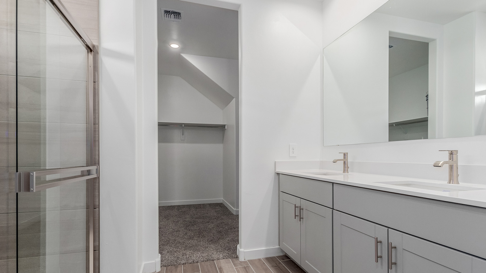 Introducing The River plan at The Oasis at Rocking K, a standout two-story new home that epitomizes spacious living and modern amenities in the scenic backdrop of Vail, Arizona. Nestled within this master-planned community, The River offers an impressive 2,396 square feet of living space, making it the largest floorplan available at The Oasis. This home is intentionally designed to accommodate the needs of growing families, with five bedrooms and three bathrooms, ensuring plenty of space for everyone.  The exterior of The River plan exudes charm and character, with its Spanish lace stucco finish and tile roof that blends seamlessly into the picturesque surroundings. The home’s front yard is meticulously landscaped with auto drip irrigation, providing a welcoming entrance to this beautiful residence.  Upon entering The River, you'll be greeted by a bright and inviting great room that flows effortlessly into the dining room and kitchen, creating a harmonious space perfect for entertaining or family gatherings. The kitchen is a chef’s day dream, featuring quartz countertops, 42” shaker-style cabinets, and stainless steel appliances, all designed to inspire culinary creativity. The main floor also includes the luxurious owner’s suite, which serves as a private sanctuary. This suite features a spacious walk-in closet and an en-suite bathroom with dual vanities, a walk-in shower, and a soaking tub, providing the perfect retreat at the end of the day. Additionally, a second bedroom on the main floor offers flexibility, ideal for guests or a home office.  As you ascend to the second story, you'll find three additional bedrooms, all with easy access to a full bathroom. A generous loft area on the second floor offers additional living space, ideal for a media room, play area, or home gym.  The River plan is not just about style and space; it’s also about modern convenience and energy efficiency. The home is equipped with D.R. Horton’s Home is Connected® Smart Home package, which includes a smart thermostat, video doorbell, keyless entry, Wi-Fi-enabled garage door opener, and Deako light switches, ensuring that your home is as functional as it is beautiful. Additionally, the home meets the DOE Zero Energy Ready Home standards, featuring energy-efficient elements such as spray foam insulation, a tankless water heater, LED lighting throughout and more.  Living at The Oasis at Rocking K means more than just owning a home; it means being part of a vibrant community. With access to amenities like ramadas, picnic areas, walking paths, and recreational fields, plus the greater Rocking K master-planned neighborhood’s splashpad, event lawn, playground, and events, there’s always something to do. Residents also enjoy the convenience of nearby schools, shopping, dining, and outdoor recreational opportunities, making The Oasis at Rocking K the perfect place to call home.  The River plan at The Oasis at Rocking K is where space, style, and smart living converge, offering a home designed for the way you live today.