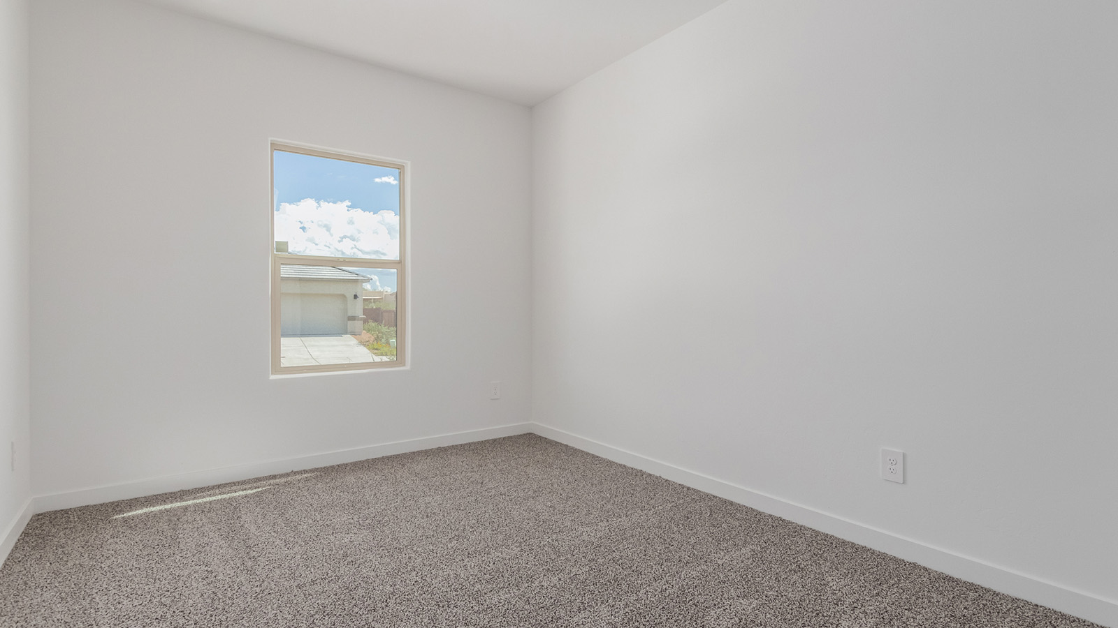 Introducing The River plan at The Oasis at Rocking K, a standout two-story new home that epitomizes spacious living and modern amenities in the scenic backdrop of Vail, Arizona. Nestled within this master-planned community, The River offers an impressive 2,396 square feet of living space, making it the largest floorplan available at The Oasis. This home is intentionally designed to accommodate the needs of growing families, with five bedrooms and three bathrooms, ensuring plenty of space for everyone.  The exterior of The River plan exudes charm and character, with its Spanish lace stucco finish and tile roof that blends seamlessly into the picturesque surroundings. The home’s front yard is meticulously landscaped with auto drip irrigation, providing a welcoming entrance to this beautiful residence.  Upon entering The River, you'll be greeted by a bright and inviting great room that flows effortlessly into the dining room and kitchen, creating a harmonious space perfect for entertaining or family gatherings. The kitchen is a chef’s day dream, featuring quartz countertops, 42” shaker-style cabinets, and stainless steel appliances, all designed to inspire culinary creativity. The main floor also includes the luxurious owner’s suite, which serves as a private sanctuary. This suite features a spacious walk-in closet and an en-suite bathroom with dual vanities, a walk-in shower, and a soaking tub, providing the perfect retreat at the end of the day. Additionally, a second bedroom on the main floor offers flexibility, ideal for guests or a home office.  As you ascend to the second story, you'll find three additional bedrooms, all with easy access to a full bathroom. A generous loft area on the second floor offers additional living space, ideal for a media room, play area, or home gym.  The River plan is not just about style and space; it’s also about modern convenience and energy efficiency. The home is equipped with D.R. Horton’s Home is Connected® Smart Home package, which includes a smart thermostat, video doorbell, keyless entry, Wi-Fi-enabled garage door opener, and Deako light switches, ensuring that your home is as functional as it is beautiful. Additionally, the home meets the DOE Zero Energy Ready Home standards, featuring energy-efficient elements such as spray foam insulation, a tankless water heater, LED lighting throughout and more.  Living at The Oasis at Rocking K means more than just owning a home; it means being part of a vibrant community. With access to amenities like ramadas, picnic areas, walking paths, and recreational fields, plus the greater Rocking K master-planned neighborhood’s splashpad, event lawn, playground, and events, there’s always something to do. Residents also enjoy the convenience of nearby schools, shopping, dining, and outdoor recreational opportunities, making The Oasis at Rocking K the perfect place to call home.  The River plan at The Oasis at Rocking K is where space, style, and smart living converge, offering a home designed for the way you live today.