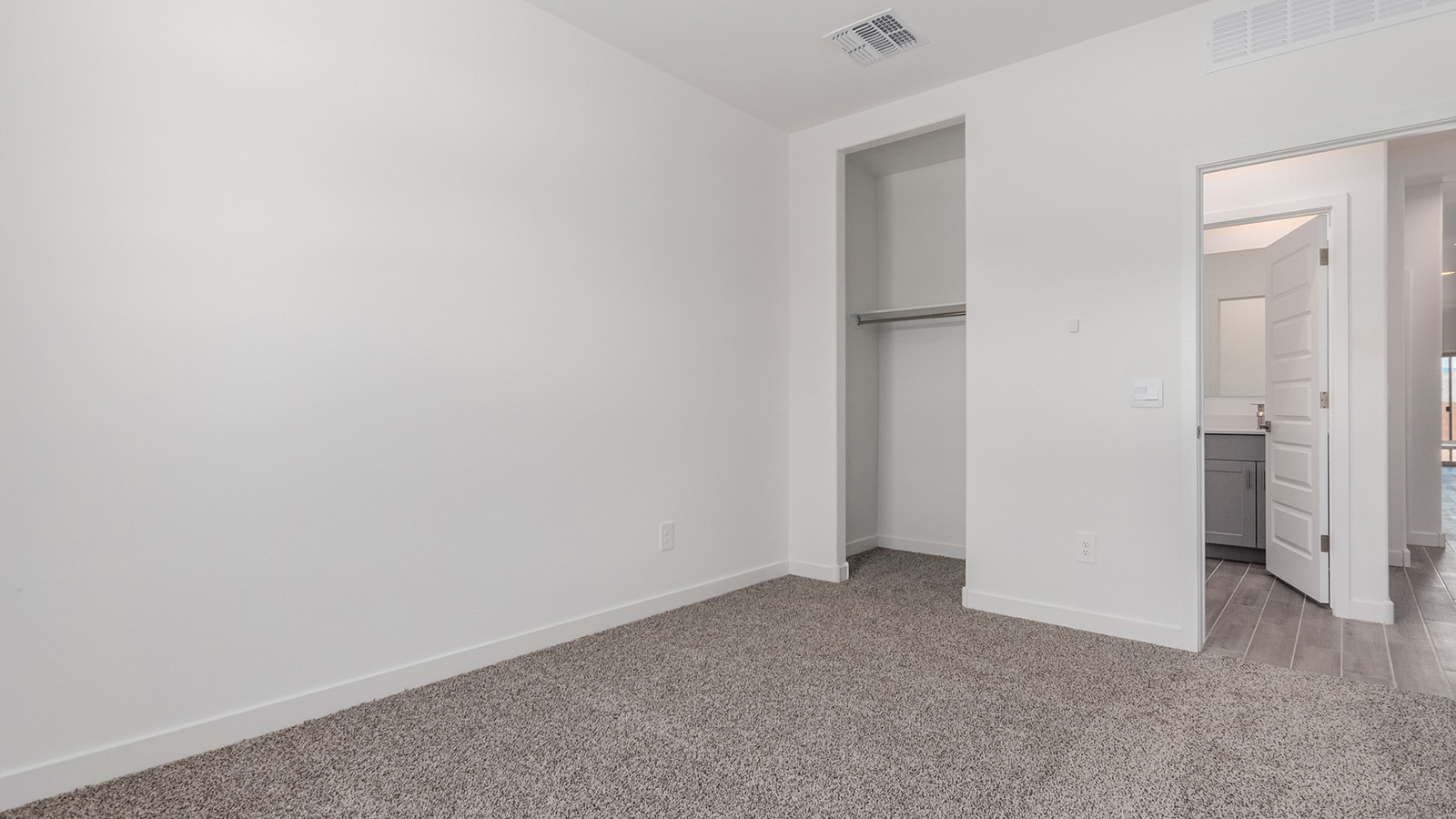 Introducing The River plan at The Oasis at Rocking K, a standout two-story new home that epitomizes spacious living and modern amenities in the scenic backdrop of Vail, Arizona. Nestled within this master-planned community, The River offers an impressive 2,396 square feet of living space, making it the largest floorplan available at The Oasis. This home is intentionally designed to accommodate the needs of growing families, with five bedrooms and three bathrooms, ensuring plenty of space for everyone.  The exterior of The River plan exudes charm and character, with its Spanish lace stucco finish and tile roof that blends seamlessly into the picturesque surroundings. The home’s front yard is meticulously landscaped with auto drip irrigation, providing a welcoming entrance to this beautiful residence.  Upon entering The River, you'll be greeted by a bright and inviting great room that flows effortlessly into the dining room and kitchen, creating a harmonious space perfect for entertaining or family gatherings. The kitchen is a chef’s day dream, featuring quartz countertops, 42” shaker-style cabinets, and stainless steel appliances, all designed to inspire culinary creativity. The main floor also includes the luxurious owner’s suite, which serves as a private sanctuary. This suite features a spacious walk-in closet and an en-suite bathroom with dual vanities, a walk-in shower, and a soaking tub, providing the perfect retreat at the end of the day. Additionally, a second bedroom on the main floor offers flexibility, ideal for guests or a home office.  As you ascend to the second story, you'll find three additional bedrooms, all with easy access to a full bathroom. A generous loft area on the second floor offers additional living space, ideal for a media room, play area, or home gym.  The River plan is not just about style and space; it’s also about modern convenience and energy efficiency. The home is equipped with D.R. Horton’s Home is Connected® Smart Home package, which includes a smart thermostat, video doorbell, keyless entry, Wi-Fi-enabled garage door opener, and Deako light switches, ensuring that your home is as functional as it is beautiful. Additionally, the home meets the DOE Zero Energy Ready Home standards, featuring energy-efficient elements such as spray foam insulation, a tankless water heater, LED lighting throughout and more.  Living at The Oasis at Rocking K means more than just owning a home; it means being part of a vibrant community. With access to amenities like ramadas, picnic areas, walking paths, and recreational fields, plus the greater Rocking K master-planned neighborhood’s splashpad, event lawn, playground, and events, there’s always something to do. Residents also enjoy the convenience of nearby schools, shopping, dining, and outdoor recreational opportunities, making The Oasis at Rocking K the perfect place to call home.  The River plan at The Oasis at Rocking K is where space, style, and smart living converge, offering a home designed for the way you live today.