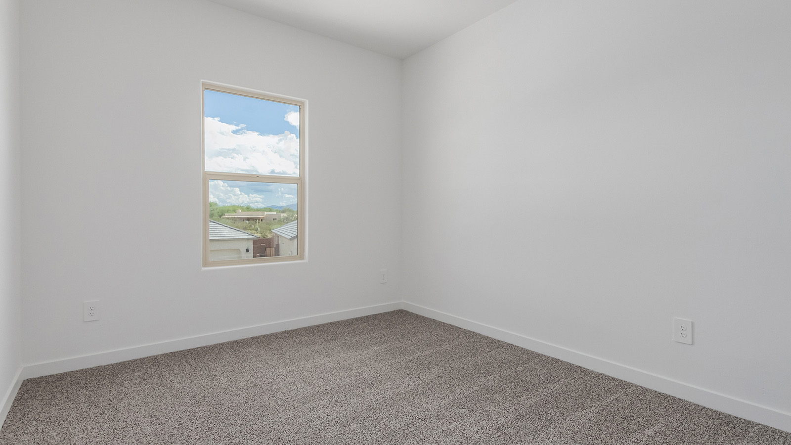 Introducing The River plan at The Oasis at Rocking K, a standout two-story new home that epitomizes spacious living and modern amenities in the scenic backdrop of Vail, Arizona. Nestled within this master-planned community, The River offers an impressive 2,396 square feet of living space, making it the largest floorplan available at The Oasis. This home is intentionally designed to accommodate the needs of growing families, with five bedrooms and three bathrooms, ensuring plenty of space for everyone.  The exterior of The River plan exudes charm and character, with its Spanish lace stucco finish and tile roof that blends seamlessly into the picturesque surroundings. The home’s front yard is meticulously landscaped with auto drip irrigation, providing a welcoming entrance to this beautiful residence.  Upon entering The River, you'll be greeted by a bright and inviting great room that flows effortlessly into the dining room and kitchen, creating a harmonious space perfect for entertaining or family gatherings. The kitchen is a chef’s day dream, featuring quartz countertops, 42” shaker-style cabinets, and stainless steel appliances, all designed to inspire culinary creativity. The main floor also includes the luxurious owner’s suite, which serves as a private sanctuary. This suite features a spacious walk-in closet and an en-suite bathroom with dual vanities, a walk-in shower, and a soaking tub, providing the perfect retreat at the end of the day. Additionally, a second bedroom on the main floor offers flexibility, ideal for guests or a home office.  As you ascend to the second story, you'll find three additional bedrooms, all with easy access to a full bathroom. A generous loft area on the second floor offers additional living space, ideal for a media room, play area, or home gym.  The River plan is not just about style and space; it’s also about modern convenience and energy efficiency. The home is equipped with D.R. Horton’s Home is Connected® Smart Home package, which includes a smart thermostat, video doorbell, keyless entry, Wi-Fi-enabled garage door opener, and Deako light switches, ensuring that your home is as functional as it is beautiful. Additionally, the home meets the DOE Zero Energy Ready Home standards, featuring energy-efficient elements such as spray foam insulation, a tankless water heater, LED lighting throughout and more.  Living at The Oasis at Rocking K means more than just owning a home; it means being part of a vibrant community. With access to amenities like ramadas, picnic areas, walking paths, and recreational fields, plus the greater Rocking K master-planned neighborhood’s splashpad, event lawn, playground, and events, there’s always something to do. Residents also enjoy the convenience of nearby schools, shopping, dining, and outdoor recreational opportunities, making The Oasis at Rocking K the perfect place to call home.  The River plan at The Oasis at Rocking K is where space, style, and smart living converge, offering a home designed for the way you live today.