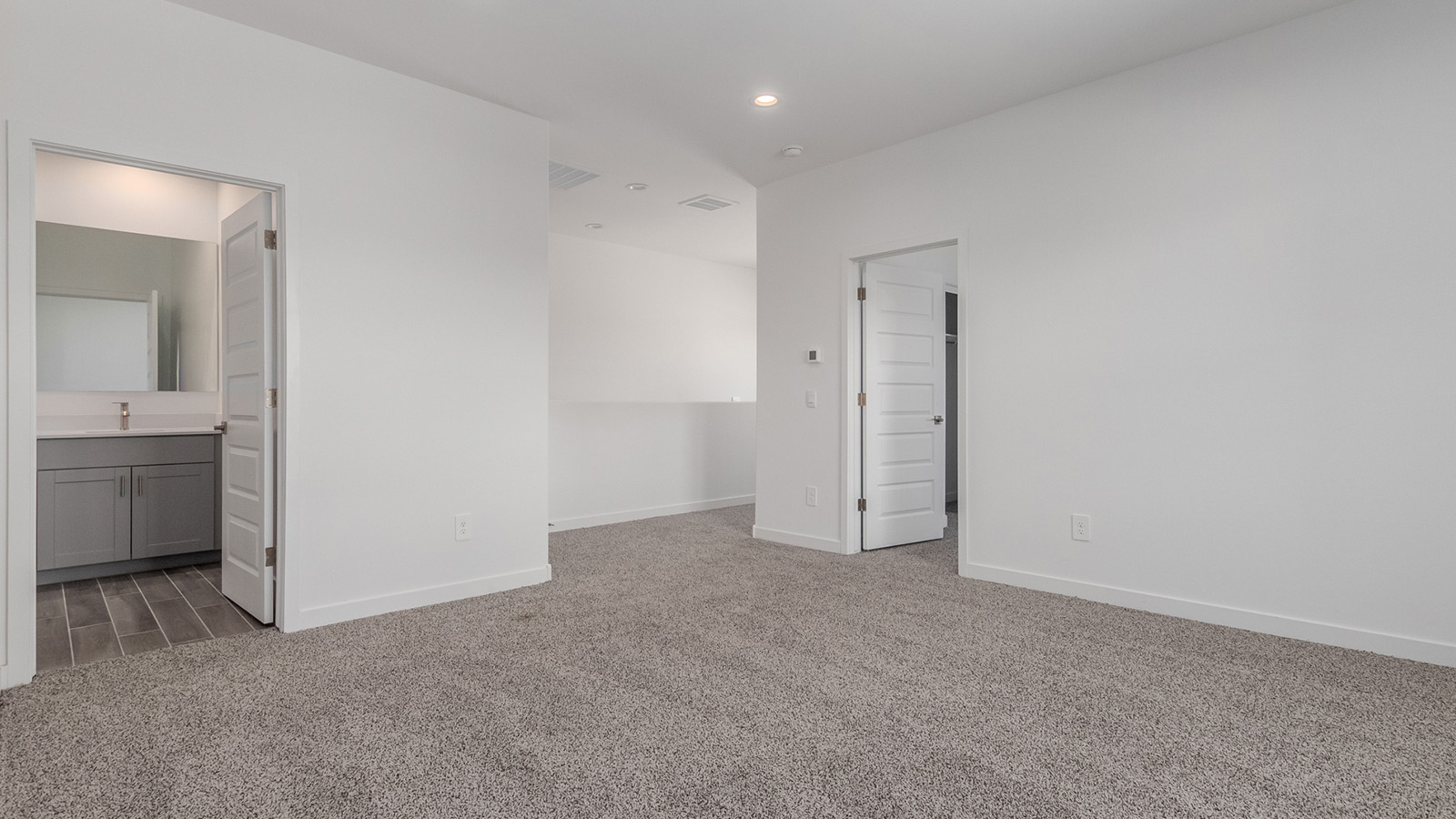 Introducing The River plan at The Oasis at Rocking K, a standout two-story new home that epitomizes spacious living and modern amenities in the scenic backdrop of Vail, Arizona. Nestled within this master-planned community, The River offers an impressive 2,396 square feet of living space, making it the largest floorplan available at The Oasis. This home is intentionally designed to accommodate the needs of growing families, with five bedrooms and three bathrooms, ensuring plenty of space for everyone.  The exterior of The River plan exudes charm and character, with its Spanish lace stucco finish and tile roof that blends seamlessly into the picturesque surroundings. The home’s front yard is meticulously landscaped with auto drip irrigation, providing a welcoming entrance to this beautiful residence.  Upon entering The River, you'll be greeted by a bright and inviting great room that flows effortlessly into the dining room and kitchen, creating a harmonious space perfect for entertaining or family gatherings. The kitchen is a chef’s day dream, featuring quartz countertops, 42” shaker-style cabinets, and stainless steel appliances, all designed to inspire culinary creativity. The main floor also includes the luxurious owner’s suite, which serves as a private sanctuary. This suite features a spacious walk-in closet and an en-suite bathroom with dual vanities, a walk-in shower, and a soaking tub, providing the perfect retreat at the end of the day. Additionally, a second bedroom on the main floor offers flexibility, ideal for guests or a home office.  As you ascend to the second story, you'll find three additional bedrooms, all with easy access to a full bathroom. A generous loft area on the second floor offers additional living space, ideal for a media room, play area, or home gym.  The River plan is not just about style and space; it’s also about modern convenience and energy efficiency. The home is equipped with D.R. Horton’s Home is Connected® Smart Home package, which includes a smart thermostat, video doorbell, keyless entry, Wi-Fi-enabled garage door opener, and Deako light switches, ensuring that your home is as functional as it is beautiful. Additionally, the home meets the DOE Zero Energy Ready Home standards, featuring energy-efficient elements such as spray foam insulation, a tankless water heater, LED lighting throughout and more.  Living at The Oasis at Rocking K means more than just owning a home; it means being part of a vibrant community. With access to amenities like ramadas, picnic areas, walking paths, and recreational fields, plus the greater Rocking K master-planned neighborhood’s splashpad, event lawn, playground, and events, there’s always something to do. Residents also enjoy the convenience of nearby schools, shopping, dining, and outdoor recreational opportunities, making The Oasis at Rocking K the perfect place to call home.  The River plan at The Oasis at Rocking K is where space, style, and smart living converge, offering a home designed for the way you live today.