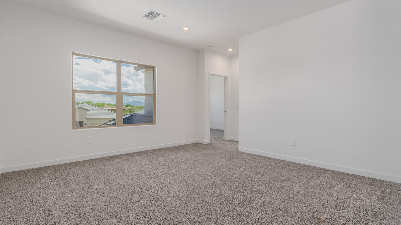 Introducing The River plan at The Oasis at Rocking K, a standout two-story new home that epitomizes spacious living and modern amenities in the scenic backdrop of Vail, Arizona. Nestled within this master-planned community, The River offers an impressive 2,396 square feet of living space, making it the largest floorplan available at The Oasis. This home is intentionally designed to accommodate the needs of growing families, with five bedrooms and three bathrooms, ensuring plenty of space for everyone.  The exterior of The River plan exudes charm and character, with its Spanish lace stucco finish and tile roof that blends seamlessly into the picturesque surroundings. The home’s front yard is meticulously landscaped with auto drip irrigation, providing a welcoming entrance to this beautiful residence.  Upon entering The River, you'll be greeted by a bright and inviting great room that flows effortlessly into the dining room and kitchen, creating a harmonious space perfect for entertaining or family gatherings. The kitchen is a chef’s day dream, featuring quartz countertops, 42” shaker-style cabinets, and stainless steel appliances, all designed to inspire culinary creativity. The main floor also includes the luxurious owner’s suite, which serves as a private sanctuary. This suite features a spacious walk-in closet and an en-suite bathroom with dual vanities, a walk-in shower, and a soaking tub, providing the perfect retreat at the end of the day. Additionally, a second bedroom on the main floor offers flexibility, ideal for guests or a home office.  As you ascend to the second story, you'll find three additional bedrooms, all with easy access to a full bathroom. A generous loft area on the second floor offers additional living space, ideal for a media room, play area, or home gym.  The River plan is not just about style and space; it’s also about modern convenience and energy efficiency. The home is equipped with D.R. Horton’s Home is Connected® Smart Home package, which includes a smart thermostat, video doorbell, keyless entry, Wi-Fi-enabled garage door opener, and Deako light switches, ensuring that your home is as functional as it is beautiful. Additionally, the home meets the DOE Zero Energy Ready Home standards, featuring energy-efficient elements such as spray foam insulation, a tankless water heater, LED lighting throughout and more.  Living at The Oasis at Rocking K means more than just owning a home; it means being part of a vibrant community. With access to amenities like ramadas, picnic areas, walking paths, and recreational fields, plus the greater Rocking K master-planned neighborhood’s splashpad, event lawn, playground, and events, there’s always something to do. Residents also enjoy the convenience of nearby schools, shopping, dining, and outdoor recreational opportunities, making The Oasis at Rocking K the perfect place to call home.  The River plan at The Oasis at Rocking K is where space, style, and smart living converge, offering a home designed for the way you live today.