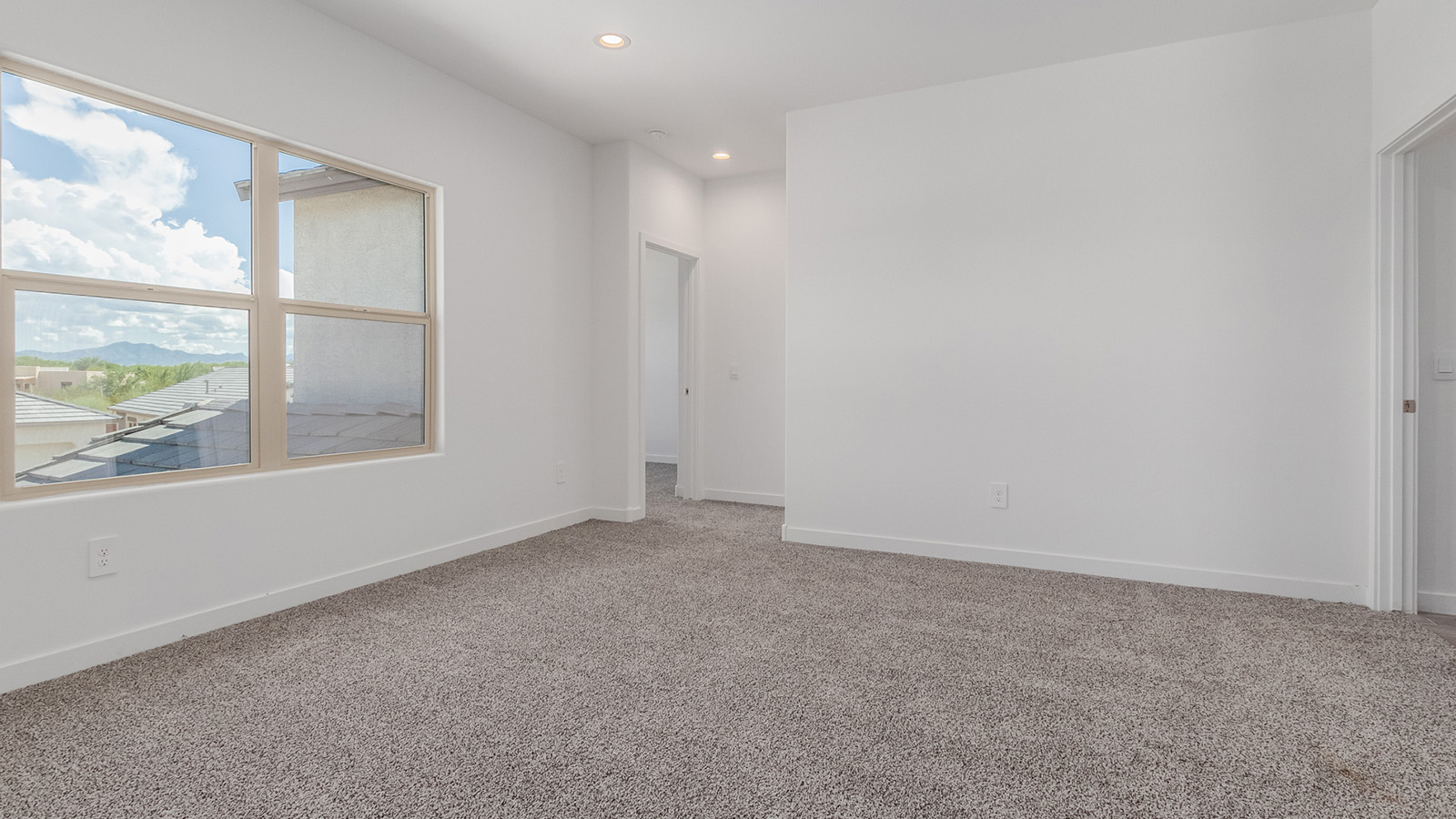 Introducing The River plan at The Oasis at Rocking K, a standout two-story new home that epitomizes spacious living and modern amenities in the scenic backdrop of Vail, Arizona. Nestled within this master-planned community, The River offers an impressive 2,396 square feet of living space, making it the largest floorplan available at The Oasis. This home is intentionally designed to accommodate the needs of growing families, with five bedrooms and three bathrooms, ensuring plenty of space for everyone.  The exterior of The River plan exudes charm and character, with its Spanish lace stucco finish and tile roof that blends seamlessly into the picturesque surroundings. The home’s front yard is meticulously landscaped with auto drip irrigation, providing a welcoming entrance to this beautiful residence.  Upon entering The River, you'll be greeted by a bright and inviting great room that flows effortlessly into the dining room and kitchen, creating a harmonious space perfect for entertaining or family gatherings. The kitchen is a chef’s day dream, featuring quartz countertops, 42” shaker-style cabinets, and stainless steel appliances, all designed to inspire culinary creativity. The main floor also includes the luxurious owner’s suite, which serves as a private sanctuary. This suite features a spacious walk-in closet and an en-suite bathroom with dual vanities, a walk-in shower, and a soaking tub, providing the perfect retreat at the end of the day. Additionally, a second bedroom on the main floor offers flexibility, ideal for guests or a home office.  As you ascend to the second story, you'll find three additional bedrooms, all with easy access to a full bathroom. A generous loft area on the second floor offers additional living space, ideal for a media room, play area, or home gym.  The River plan is not just about style and space; it’s also about modern convenience and energy efficiency. The home is equipped with D.R. Horton’s Home is Connected® Smart Home package, which includes a smart thermostat, video doorbell, keyless entry, Wi-Fi-enabled garage door opener, and Deako light switches, ensuring that your home is as functional as it is beautiful. Additionally, the home meets the DOE Zero Energy Ready Home standards, featuring energy-efficient elements such as spray foam insulation, a tankless water heater, LED lighting throughout and more.  Living at The Oasis at Rocking K means more than just owning a home; it means being part of a vibrant community. With access to amenities like ramadas, picnic areas, walking paths, and recreational fields, plus the greater Rocking K master-planned neighborhood’s splashpad, event lawn, playground, and events, there’s always something to do. Residents also enjoy the convenience of nearby schools, shopping, dining, and outdoor recreational opportunities, making The Oasis at Rocking K the perfect place to call home.  The River plan at The Oasis at Rocking K is where space, style, and smart living converge, offering a home designed for the way you live today.