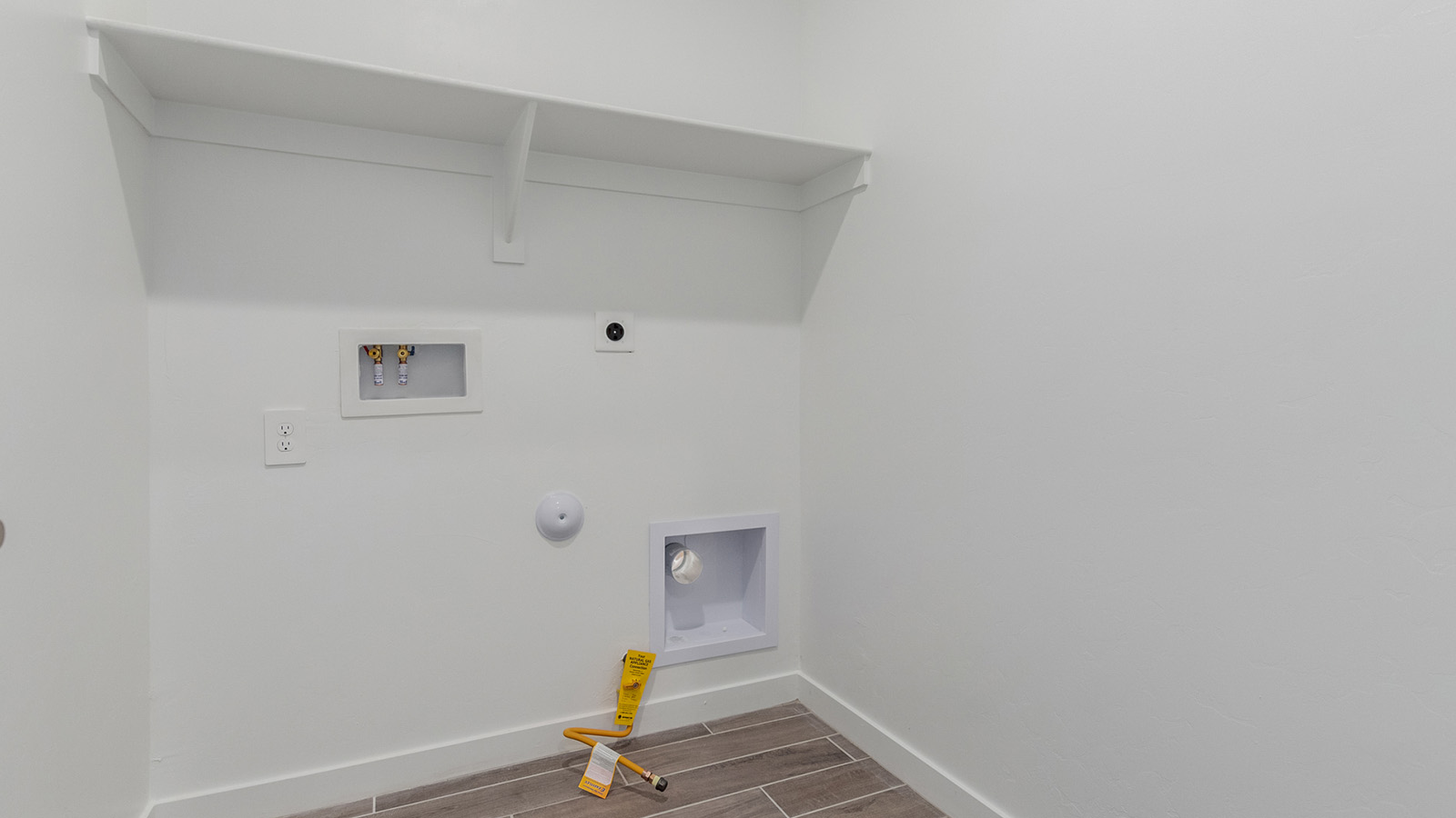 Introducing The River plan at The Oasis at Rocking K, a standout two-story new home that epitomizes spacious living and modern amenities in the scenic backdrop of Vail, Arizona. Nestled within this master-planned community, The River offers an impressive 2,396 square feet of living space, making it the largest floorplan available at The Oasis. This home is intentionally designed to accommodate the needs of growing families, with five bedrooms and three bathrooms, ensuring plenty of space for everyone.  The exterior of The River plan exudes charm and character, with its Spanish lace stucco finish and tile roof that blends seamlessly into the picturesque surroundings. The home’s front yard is meticulously landscaped with auto drip irrigation, providing a welcoming entrance to this beautiful residence.  Upon entering The River, you'll be greeted by a bright and inviting great room that flows effortlessly into the dining room and kitchen, creating a harmonious space perfect for entertaining or family gatherings. The kitchen is a chef’s day dream, featuring quartz countertops, 42” shaker-style cabinets, and stainless steel appliances, all designed to inspire culinary creativity. The main floor also includes the luxurious owner’s suite, which serves as a private sanctuary. This suite features a spacious walk-in closet and an en-suite bathroom with dual vanities, a walk-in shower, and a soaking tub, providing the perfect retreat at the end of the day. Additionally, a second bedroom on the main floor offers flexibility, ideal for guests or a home office.  As you ascend to the second story, you'll find three additional bedrooms, all with easy access to a full bathroom. A generous loft area on the second floor offers additional living space, ideal for a media room, play area, or home gym.  The River plan is not just about style and space; it’s also about modern convenience and energy efficiency. The home is equipped with D.R. Horton’s Home is Connected® Smart Home package, which includes a smart thermostat, video doorbell, keyless entry, Wi-Fi-enabled garage door opener, and Deako light switches, ensuring that your home is as functional as it is beautiful. Additionally, the home meets the DOE Zero Energy Ready Home standards, featuring energy-efficient elements such as spray foam insulation, a tankless water heater, LED lighting throughout and more.  Living at The Oasis at Rocking K means more than just owning a home; it means being part of a vibrant community. With access to amenities like ramadas, picnic areas, walking paths, and recreational fields, plus the greater Rocking K master-planned neighborhood’s splashpad, event lawn, playground, and events, there’s always something to do. Residents also enjoy the convenience of nearby schools, shopping, dining, and outdoor recreational opportunities, making The Oasis at Rocking K the perfect place to call home.  The River plan at The Oasis at Rocking K is where space, style, and smart living converge, offering a home designed for the way you live today.