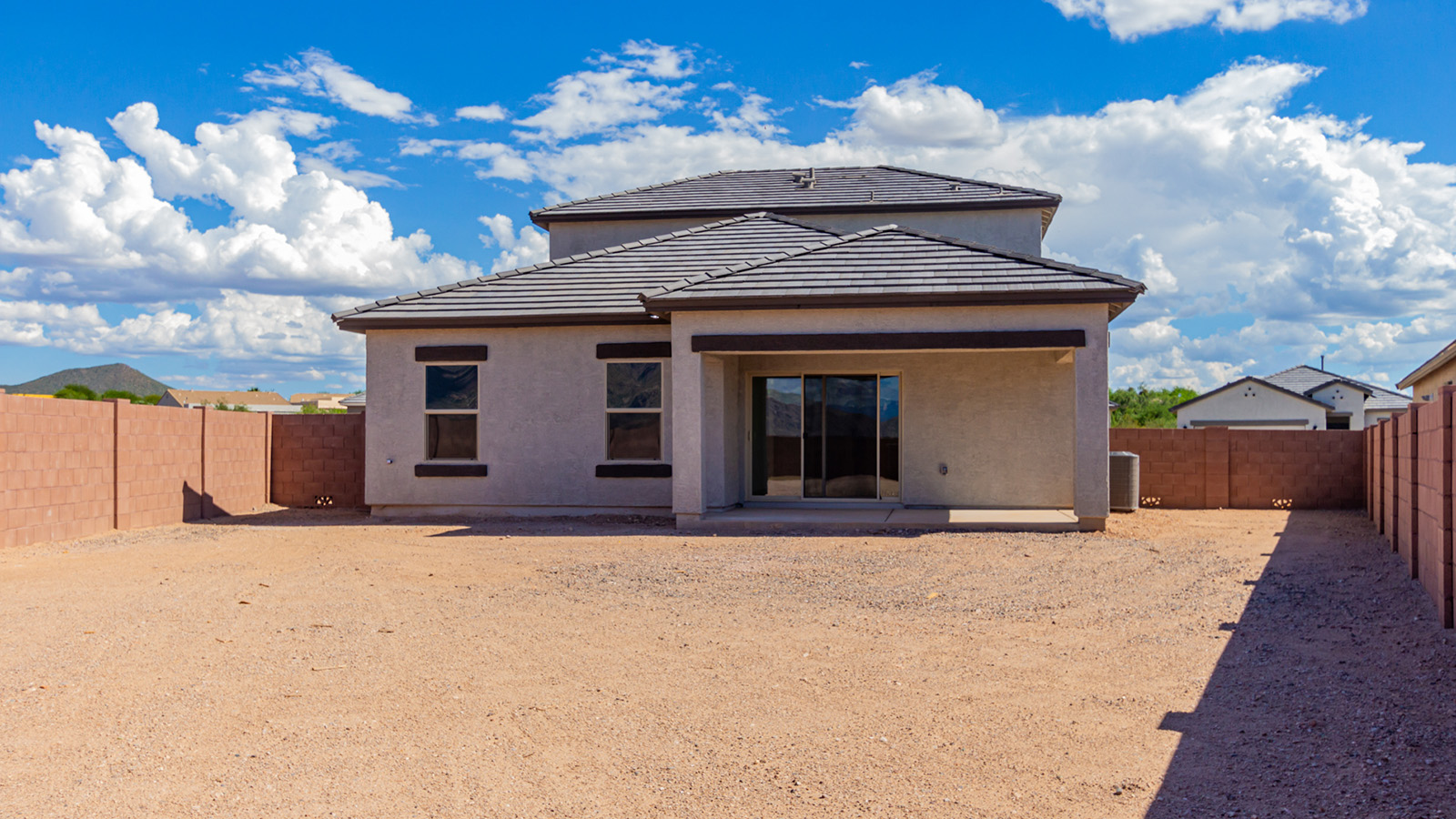 Introducing The River plan at The Oasis at Rocking K, a standout two-story new home that epitomizes spacious living and modern amenities in the scenic backdrop of Vail, Arizona. Nestled within this master-planned community, The River offers an impressive 2,396 square feet of living space, making it the largest floorplan available at The Oasis. This home is intentionally designed to accommodate the needs of growing families, with five bedrooms and three bathrooms, ensuring plenty of space for everyone.  The exterior of The River plan exudes charm and character, with its Spanish lace stucco finish and tile roof that blends seamlessly into the picturesque surroundings. The home’s front yard is meticulously landscaped with auto drip irrigation, providing a welcoming entrance to this beautiful residence.  Upon entering The River, you'll be greeted by a bright and inviting great room that flows effortlessly into the dining room and kitchen, creating a harmonious space perfect for entertaining or family gatherings. The kitchen is a chef’s day dream, featuring quartz countertops, 42” shaker-style cabinets, and stainless steel appliances, all designed to inspire culinary creativity. The main floor also includes the luxurious owner’s suite, which serves as a private sanctuary. This suite features a spacious walk-in closet and an en-suite bathroom with dual vanities, a walk-in shower, and a soaking tub, providing the perfect retreat at the end of the day. Additionally, a second bedroom on the main floor offers flexibility, ideal for guests or a home office.  As you ascend to the second story, you'll find three additional bedrooms, all with easy access to a full bathroom. A generous loft area on the second floor offers additional living space, ideal for a media room, play area, or home gym.  The River plan is not just about style and space; it’s also about modern convenience and energy efficiency. The home is equipped with D.R. Horton’s Home is Connected® Smart Home package, which includes a smart thermostat, video doorbell, keyless entry, Wi-Fi-enabled garage door opener, and Deako light switches, ensuring that your home is as functional as it is beautiful. Additionally, the home meets the DOE Zero Energy Ready Home standards, featuring energy-efficient elements such as spray foam insulation, a tankless water heater, LED lighting throughout and more.  Living at The Oasis at Rocking K means more than just owning a home; it means being part of a vibrant community. With access to amenities like ramadas, picnic areas, walking paths, and recreational fields, plus the greater Rocking K master-planned neighborhood’s splashpad, event lawn, playground, and events, there’s always something to do. Residents also enjoy the convenience of nearby schools, shopping, dining, and outdoor recreational opportunities, making The Oasis at Rocking K the perfect place to call home.  The River plan at The Oasis at Rocking K is where space, style, and smart living converge, offering a home designed for the way you live today.