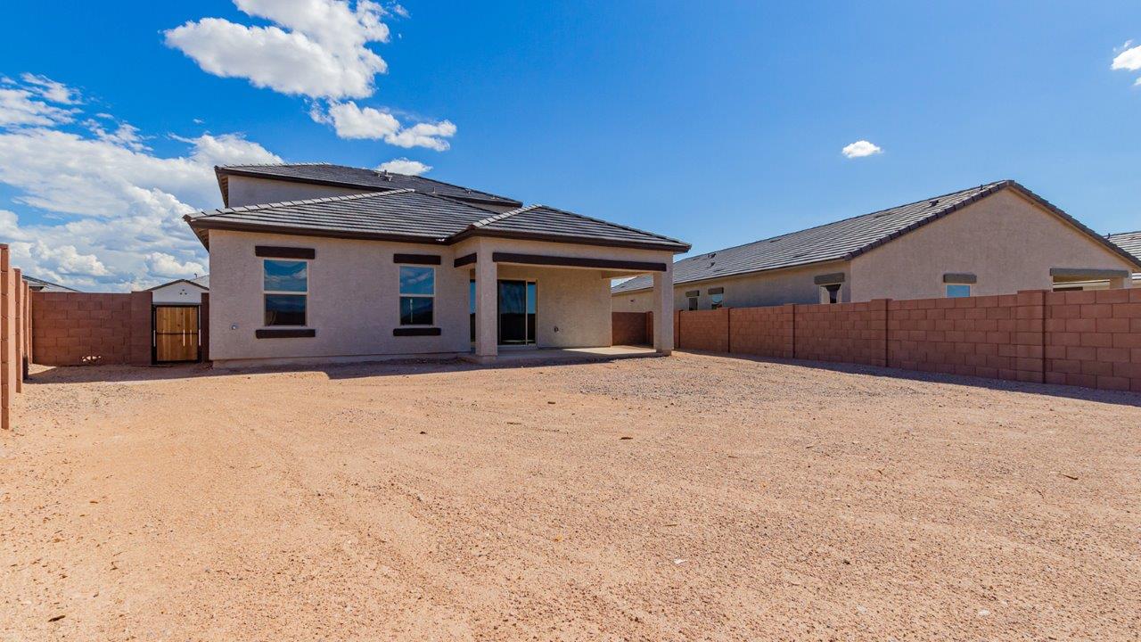 Introducing The River plan at The Oasis at Rocking K, a standout two-story new home that epitomizes spacious living and modern amenities in the scenic backdrop of Vail, Arizona. Nestled within this master-planned community, The River offers an impressive 2,396 square feet of living space, making it the largest floorplan available at The Oasis. This home is intentionally designed to accommodate the needs of growing families, with five bedrooms and three bathrooms, ensuring plenty of space for everyone.  The exterior of The River plan exudes charm and character, with its Spanish lace stucco finish and tile roof that blends seamlessly into the picturesque surroundings. The home’s front yard is meticulously landscaped with auto drip irrigation, providing a welcoming entrance to this beautiful residence.  Upon entering The River, you'll be greeted by a bright and inviting great room that flows effortlessly into the dining room and kitchen, creating a harmonious space perfect for entertaining or family gatherings. The kitchen is a chef’s day dream, featuring quartz countertops, 42” shaker-style cabinets, and stainless steel appliances, all designed to inspire culinary creativity. The main floor also includes the luxurious owner’s suite, which serves as a private sanctuary. This suite features a spacious walk-in closet and an en-suite bathroom with dual vanities, a walk-in shower, and a soaking tub, providing the perfect retreat at the end of the day. Additionally, a second bedroom on the main floor offers flexibility, ideal for guests or a home office.  As you ascend to the second story, you'll find three additional bedrooms, all with easy access to a full bathroom. A generous loft area on the second floor offers additional living space, ideal for a media room, play area, or home gym.  The River plan is not just about style and space; it’s also about modern convenience and energy efficiency. The home is equipped with D.R. Horton’s Home is Connected® Smart Home package, which includes a smart thermostat, video doorbell, keyless entry, Wi-Fi-enabled garage door opener, and Deako light switches, ensuring that your home is as functional as it is beautiful. Additionally, the home meets the DOE Zero Energy Ready Home standards, featuring energy-efficient elements such as spray foam insulation, a tankless water heater, LED lighting throughout and more.  Living at The Oasis at Rocking K means more than just owning a home; it means being part of a vibrant community. With access to amenities like ramadas, picnic areas, walking paths, and recreational fields, plus the greater Rocking K master-planned neighborhood’s splashpad, event lawn, playground, and events, there’s always something to do. Residents also enjoy the convenience of nearby schools, shopping, dining, and outdoor recreational opportunities, making The Oasis at Rocking K the perfect place to call home.  The River plan at The Oasis at Rocking K is where space, style, and smart living converge, offering a home designed for the way you live today.