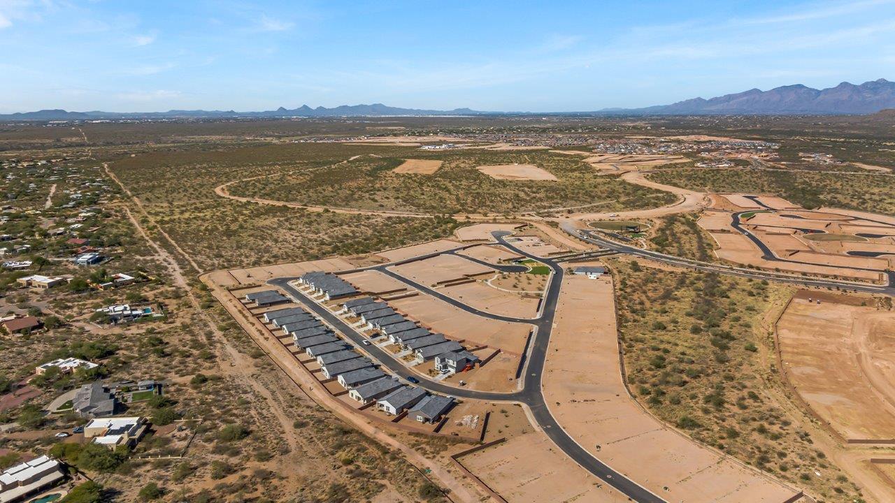 Introducing The River plan at The Oasis at Rocking K, a standout two-story new home that epitomizes spacious living and modern amenities in the scenic backdrop of Vail, Arizona. Nestled within this master-planned community, The River offers an impressive 2,396 square feet of living space, making it the largest floorplan available at The Oasis. This home is intentionally designed to accommodate the needs of growing families, with five bedrooms and three bathrooms, ensuring plenty of space for everyone.  The exterior of The River plan exudes charm and character, with its Spanish lace stucco finish and tile roof that blends seamlessly into the picturesque surroundings. The home’s front yard is meticulously landscaped with auto drip irrigation, providing a welcoming entrance to this beautiful residence.  Upon entering The River, you'll be greeted by a bright and inviting great room that flows effortlessly into the dining room and kitchen, creating a harmonious space perfect for entertaining or family gatherings. The kitchen is a chef’s day dream, featuring quartz countertops, 42” shaker-style cabinets, and stainless steel appliances, all designed to inspire culinary creativity. The main floor also includes the luxurious owner’s suite, which serves as a private sanctuary. This suite features a spacious walk-in closet and an en-suite bathroom with dual vanities, a walk-in shower, and a soaking tub, providing the perfect retreat at the end of the day. Additionally, a second bedroom on the main floor offers flexibility, ideal for guests or a home office.  As you ascend to the second story, you'll find three additional bedrooms, all with easy access to a full bathroom. A generous loft area on the second floor offers additional living space, ideal for a media room, play area, or home gym.  The River plan is not just about style and space; it’s also about modern convenience and energy efficiency. The home is equipped with D.R. Horton’s Home is Connected® Smart Home package, which includes a smart thermostat, video doorbell, keyless entry, Wi-Fi-enabled garage door opener, and Deako light switches, ensuring that your home is as functional as it is beautiful. Additionally, the home meets the DOE Zero Energy Ready Home standards, featuring energy-efficient elements such as spray foam insulation, a tankless water heater, LED lighting throughout and more.  Living at The Oasis at Rocking K means more than just owning a home; it means being part of a vibrant community. With access to amenities like ramadas, picnic areas, walking paths, and recreational fields, plus the greater Rocking K master-planned neighborhood’s splashpad, event lawn, playground, and events, there’s always something to do. Residents also enjoy the convenience of nearby schools, shopping, dining, and outdoor recreational opportunities, making The Oasis at Rocking K the perfect place to call home.  The River plan at The Oasis at Rocking K is where space, style, and smart living converge, offering a home designed for the way you live today.