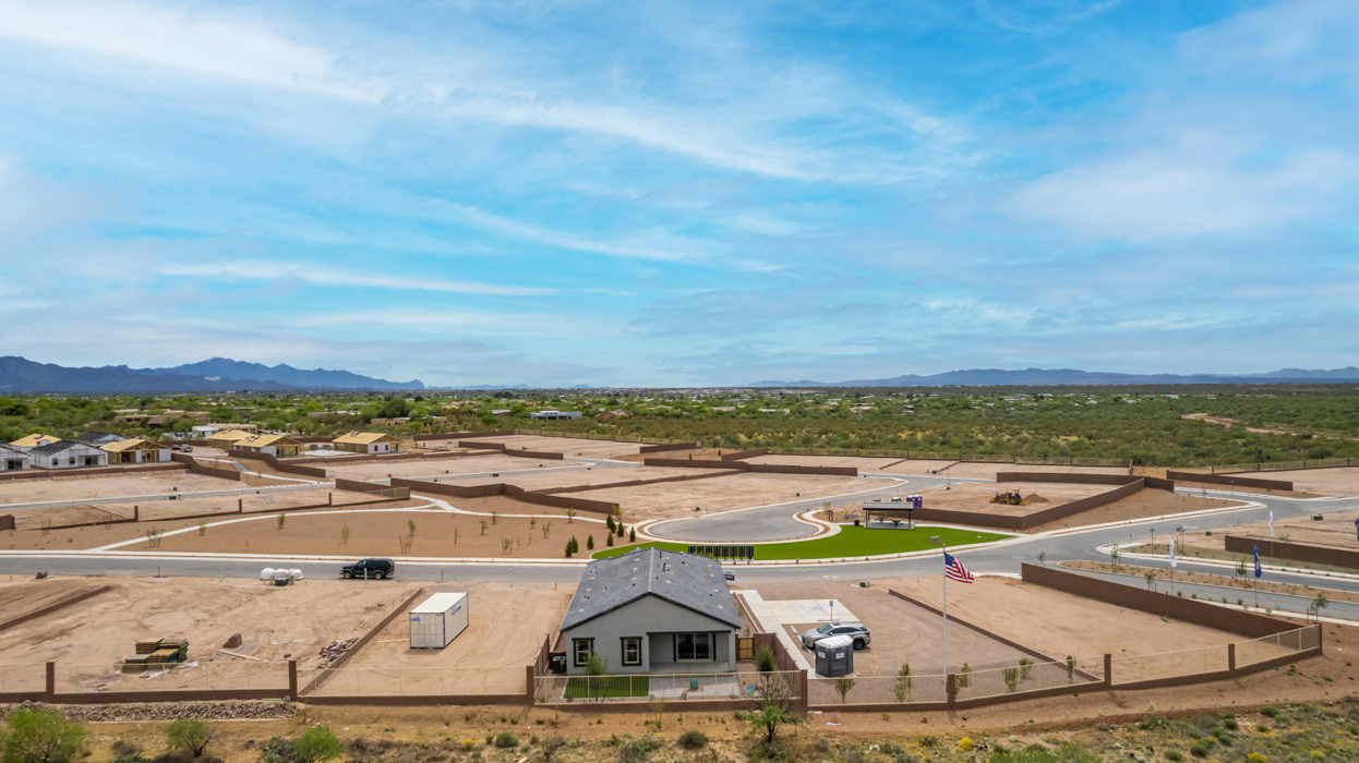 Introducing The River plan at The Oasis at Rocking K, a standout two-story new home that epitomizes spacious living and modern amenities in the scenic backdrop of Vail, Arizona. Nestled within this master-planned community, The River offers an impressive 2,396 square feet of living space, making it the largest floorplan available at The Oasis. This home is intentionally designed to accommodate the needs of growing families, with five bedrooms and three bathrooms, ensuring plenty of space for everyone.  The exterior of The River plan exudes charm and character, with its Spanish lace stucco finish and tile roof that blends seamlessly into the picturesque surroundings. The home’s front yard is meticulously landscaped with auto drip irrigation, providing a welcoming entrance to this beautiful residence.  Upon entering The River, you'll be greeted by a bright and inviting great room that flows effortlessly into the dining room and kitchen, creating a harmonious space perfect for entertaining or family gatherings. The kitchen is a chef’s day dream, featuring quartz countertops, 42” shaker-style cabinets, and stainless steel appliances, all designed to inspire culinary creativity. The main floor also includes the luxurious owner’s suite, which serves as a private sanctuary. This suite features a spacious walk-in closet and an en-suite bathroom with dual vanities, a walk-in shower, and a soaking tub, providing the perfect retreat at the end of the day. Additionally, a second bedroom on the main floor offers flexibility, ideal for guests or a home office.  As you ascend to the second story, you'll find three additional bedrooms, all with easy access to a full bathroom. A generous loft area on the second floor offers additional living space, ideal for a media room, play area, or home gym.  The River plan is not just about style and space; it’s also about modern convenience and energy efficiency. The home is equipped with D.R. Horton’s Home is Connected® Smart Home package, which includes a smart thermostat, video doorbell, keyless entry, Wi-Fi-enabled garage door opener, and Deako light switches, ensuring that your home is as functional as it is beautiful. Additionally, the home meets the DOE Zero Energy Ready Home standards, featuring energy-efficient elements such as spray foam insulation, a tankless water heater, LED lighting throughout and more.  Living at The Oasis at Rocking K means more than just owning a home; it means being part of a vibrant community. With access to amenities like ramadas, picnic areas, walking paths, and recreational fields, plus the greater Rocking K master-planned neighborhood’s splashpad, event lawn, playground, and events, there’s always something to do. Residents also enjoy the convenience of nearby schools, shopping, dining, and outdoor recreational opportunities, making The Oasis at Rocking K the perfect place to call home.  The River plan at The Oasis at Rocking K is where space, style, and smart living converge, offering a home designed for the way you live today.