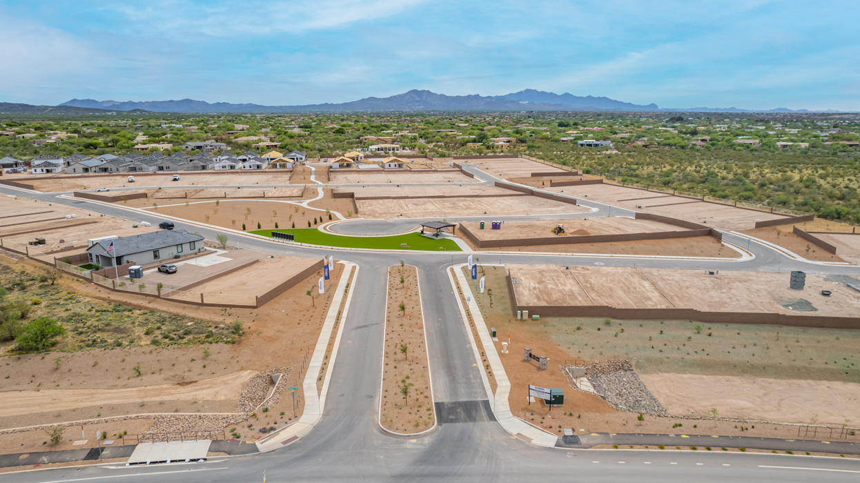 Introducing The River plan at The Oasis at Rocking K, a standout two-story new home that epitomizes spacious living and modern amenities in the scenic backdrop of Vail, Arizona. Nestled within this master-planned community, The River offers an impressive 2,396 square feet of living space, making it the largest floorplan available at The Oasis. This home is intentionally designed to accommodate the needs of growing families, with five bedrooms and three bathrooms, ensuring plenty of space for everyone.  The exterior of The River plan exudes charm and character, with its Spanish lace stucco finish and tile roof that blends seamlessly into the picturesque surroundings. The home’s front yard is meticulously landscaped with auto drip irrigation, providing a welcoming entrance to this beautiful residence.  Upon entering The River, you'll be greeted by a bright and inviting great room that flows effortlessly into the dining room and kitchen, creating a harmonious space perfect for entertaining or family gatherings. The kitchen is a chef’s day dream, featuring quartz countertops, 42” shaker-style cabinets, and stainless steel appliances, all designed to inspire culinary creativity. The main floor also includes the luxurious owner’s suite, which serves as a private sanctuary. This suite features a spacious walk-in closet and an en-suite bathroom with dual vanities, a walk-in shower, and a soaking tub, providing the perfect retreat at the end of the day. Additionally, a second bedroom on the main floor offers flexibility, ideal for guests or a home office.  As you ascend to the second story, you'll find three additional bedrooms, all with easy access to a full bathroom. A generous loft area on the second floor offers additional living space, ideal for a media room, play area, or home gym.  The River plan is not just about style and space; it’s also about modern convenience and energy efficiency. The home is equipped with D.R. Horton’s Home is Connected® Smart Home package, which includes a smart thermostat, video doorbell, keyless entry, Wi-Fi-enabled garage door opener, and Deako light switches, ensuring that your home is as functional as it is beautiful. Additionally, the home meets the DOE Zero Energy Ready Home standards, featuring energy-efficient elements such as spray foam insulation, a tankless water heater, LED lighting throughout and more.  Living at The Oasis at Rocking K means more than just owning a home; it means being part of a vibrant community. With access to amenities like ramadas, picnic areas, walking paths, and recreational fields, plus the greater Rocking K master-planned neighborhood’s splashpad, event lawn, playground, and events, there’s always something to do. Residents also enjoy the convenience of nearby schools, shopping, dining, and outdoor recreational opportunities, making The Oasis at Rocking K the perfect place to call home.  The River plan at The Oasis at Rocking K is where space, style, and smart living converge, offering a home designed for the way you live today.