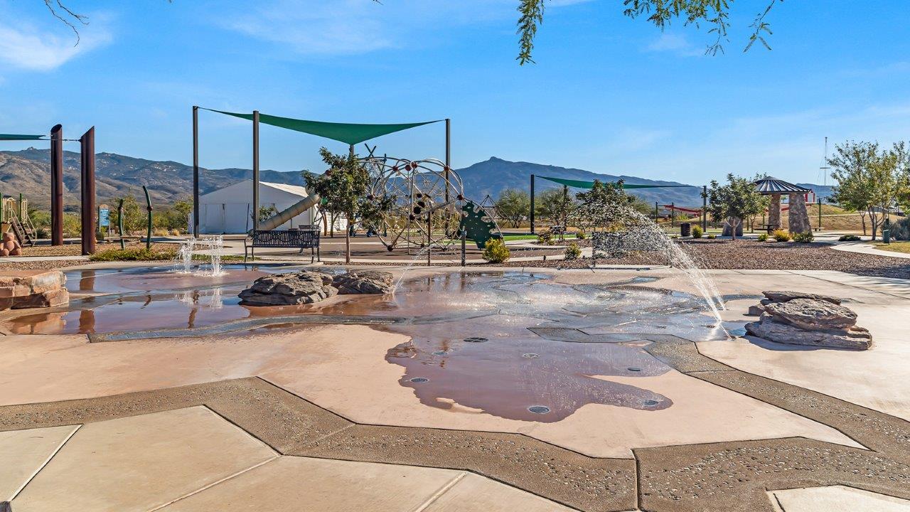 Introducing The River plan at The Oasis at Rocking K, a standout two-story new home that epitomizes spacious living and modern amenities in the scenic backdrop of Vail, Arizona. Nestled within this master-planned community, The River offers an impressive 2,396 square feet of living space, making it the largest floorplan available at The Oasis. This home is intentionally designed to accommodate the needs of growing families, with five bedrooms and three bathrooms, ensuring plenty of space for everyone.  The exterior of The River plan exudes charm and character, with its Spanish lace stucco finish and tile roof that blends seamlessly into the picturesque surroundings. The home’s front yard is meticulously landscaped with auto drip irrigation, providing a welcoming entrance to this beautiful residence.  Upon entering The River, you'll be greeted by a bright and inviting great room that flows effortlessly into the dining room and kitchen, creating a harmonious space perfect for entertaining or family gatherings. The kitchen is a chef’s day dream, featuring quartz countertops, 42” shaker-style cabinets, and stainless steel appliances, all designed to inspire culinary creativity. The main floor also includes the luxurious owner’s suite, which serves as a private sanctuary. This suite features a spacious walk-in closet and an en-suite bathroom with dual vanities, a walk-in shower, and a soaking tub, providing the perfect retreat at the end of the day. Additionally, a second bedroom on the main floor offers flexibility, ideal for guests or a home office.  As you ascend to the second story, you'll find three additional bedrooms, all with easy access to a full bathroom. A generous loft area on the second floor offers additional living space, ideal for a media room, play area, or home gym.  The River plan is not just about style and space; it’s also about modern convenience and energy efficiency. The home is equipped with D.R. Horton’s Home is Connected® Smart Home package, which includes a smart thermostat, video doorbell, keyless entry, Wi-Fi-enabled garage door opener, and Deako light switches, ensuring that your home is as functional as it is beautiful. Additionally, the home meets the DOE Zero Energy Ready Home standards, featuring energy-efficient elements such as spray foam insulation, a tankless water heater, LED lighting throughout and more.  Living at The Oasis at Rocking K means more than just owning a home; it means being part of a vibrant community. With access to amenities like ramadas, picnic areas, walking paths, and recreational fields, plus the greater Rocking K master-planned neighborhood’s splashpad, event lawn, playground, and events, there’s always something to do. Residents also enjoy the convenience of nearby schools, shopping, dining, and outdoor recreational opportunities, making The Oasis at Rocking K the perfect place to call home.  The River plan at The Oasis at Rocking K is where space, style, and smart living converge, offering a home designed for the way you live today.