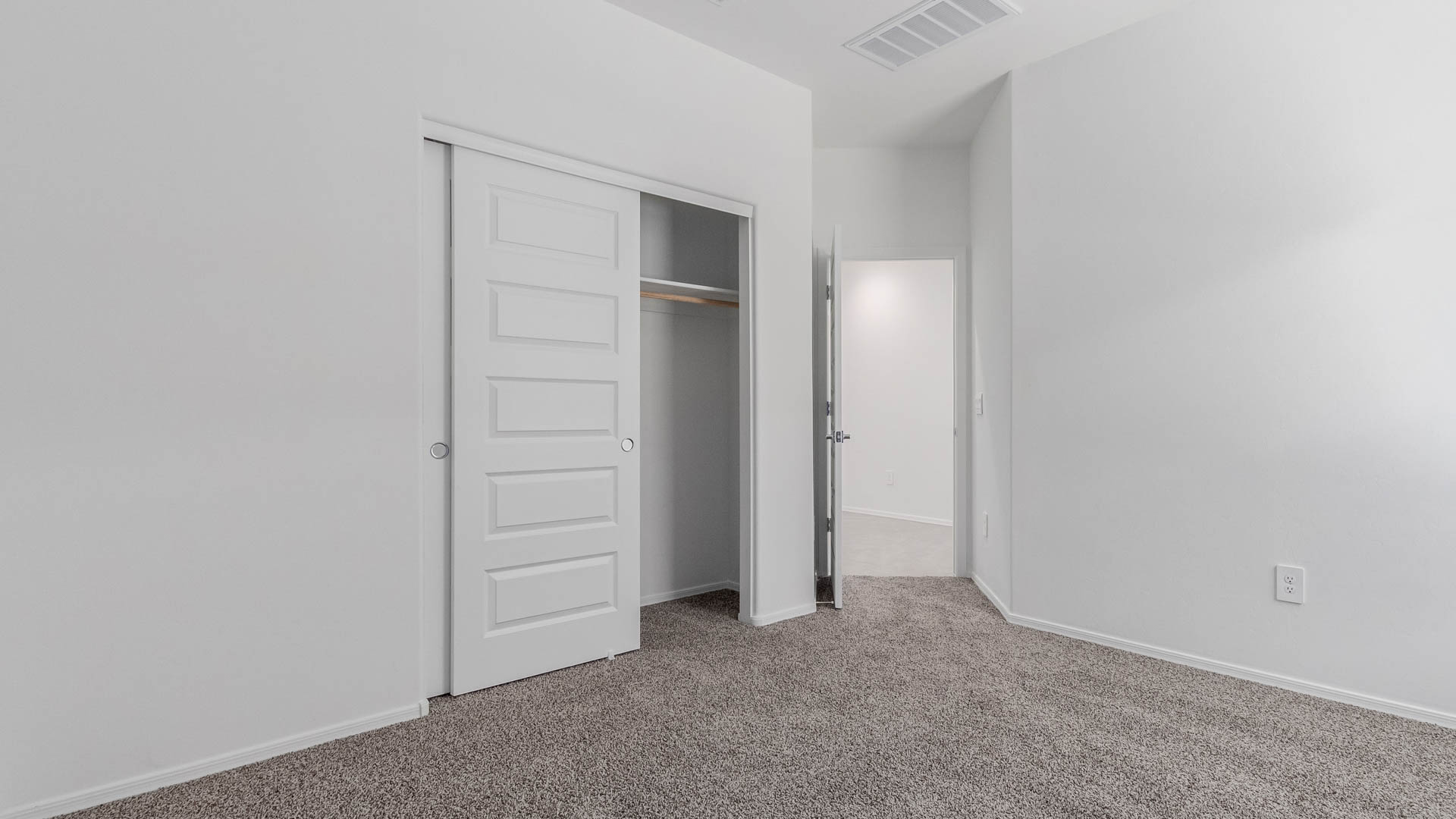 The Parker floor plan is one of the expansive new homes featured at The Oasis at Rocking K in Vail, Arizona. This vibrant community is nestled against the backdrop of the Rincon Mountains. The Parker stands out as a spacious single-story new home, offering 1,914 square feet of living space, making it the largest single-story floorplan available in this community.  The Parker is a reflection of elegance that defines The Oasis at Rocking K. The beautifully landscaped front yard, complete with an irrigation system, enhances the curb appeal, with a covered front porch.  Step into a well-planned layout that effortlessly balances functionality. The Parker features five bedrooms, including a private primary suite with a walk-in closet and en-suite bathroom. The additional bedrooms are thoughtfully situated to provide privacy and comfort, with easy access to two full bathrooms.  The heart of The Parker is the kitchen, which seamlessly connects to the dining room and great room. The kitchen is equipped with high-end finishes, including quartz countertops, shaker-style cabinets, and stainless-steel appliances. A generous pantry and plenty of cabinet space ensure that storage is never an issue.  The Parker includes a covered back patio, perfect for enjoying the tranquility of the surrounding landscape. Inside, the home features durable wood-look tile flooring in the main living areas, adding warmth and elegance to the space.  The Parker comes equipped with the Home is Connected® Smart Home package. This includes a smart thermostat, video doorbell, keyless entry, and more. Additionally, the home meets DOE Zero Energy Ready Home standards, with features like spray foam insulation and tankless water heaters, ensuring long-term savings and a reduced environmental footprint.  Living in The Oasis at Rocking K means enjoying a community rich in amenities. Whether you’re seeking a peaceful retreat or an active lifestyle, The Parker at The Oasis at Rocking K offers the perfect home base.