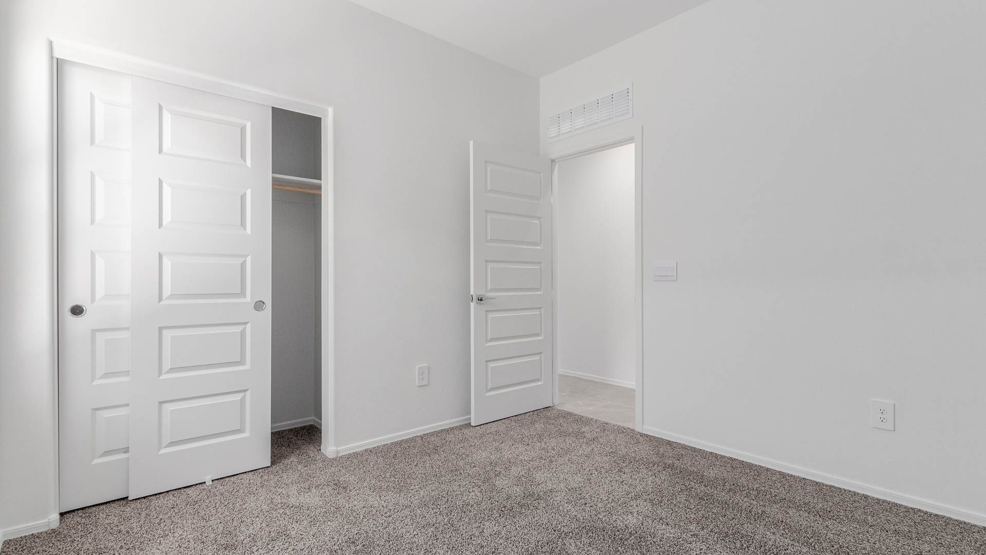 The Parker floor plan is one of the expansive new homes featured at The Oasis at Rocking K in Vail, Arizona. This vibrant community is nestled against the backdrop of the Rincon Mountains. The Parker stands out as a spacious single-story new home, offering 1,914 square feet of living space, making it the largest single-story floorplan available in this community.  The Parker is a reflection of elegance that defines The Oasis at Rocking K. The beautifully landscaped front yard, complete with an irrigation system, enhances the curb appeal, with a covered front porch.  Step into a well-planned layout that effortlessly balances functionality. The Parker features five bedrooms, including a private primary suite with a walk-in closet and en-suite bathroom. The additional bedrooms are thoughtfully situated to provide privacy and comfort, with easy access to two full bathrooms.  The heart of The Parker is the kitchen, which seamlessly connects to the dining room and great room. The kitchen is equipped with high-end finishes, including quartz countertops, shaker-style cabinets, and stainless-steel appliances. A generous pantry and plenty of cabinet space ensure that storage is never an issue.  The Parker includes a covered back patio, perfect for enjoying the tranquility of the surrounding landscape. Inside, the home features durable wood-look tile flooring in the main living areas, adding warmth and elegance to the space.  The Parker comes equipped with the Home is Connected® Smart Home package. This includes a smart thermostat, video doorbell, keyless entry, and more. Additionally, the home meets DOE Zero Energy Ready Home standards, with features like spray foam insulation and tankless water heaters, ensuring long-term savings and a reduced environmental footprint.  Living in The Oasis at Rocking K means enjoying a community rich in amenities. Whether you’re seeking a peaceful retreat or an active lifestyle, The Parker at The Oasis at Rocking K offers the perfect home base.