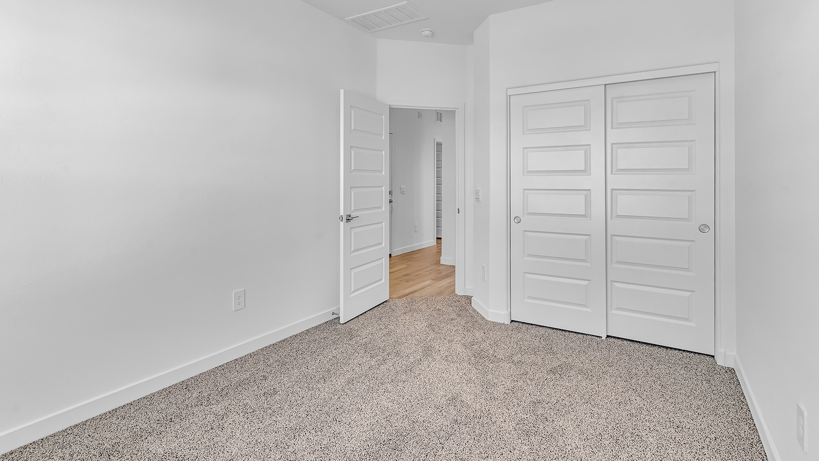 The Parker floor plan is one of the expansive new homes featured at The Oasis at Rocking K in Vail, Arizona. This vibrant community is nestled against the backdrop of the Rincon Mountains. The Parker stands out as a spacious single-story new home, offering 1,914 square feet of living space, making it the largest single-story floorplan available in this community.  The Parker is a reflection of elegance that defines The Oasis at Rocking K. The beautifully landscaped front yard, complete with an irrigation system, enhances the curb appeal, with a covered front porch.  Step into a well-planned layout that effortlessly balances functionality. The Parker features five bedrooms, including a private primary suite with a walk-in closet and en-suite bathroom. The additional bedrooms are thoughtfully situated to provide privacy and comfort, with easy access to two full bathrooms.  The heart of The Parker is the kitchen, which seamlessly connects to the dining room and great room. The kitchen is equipped with high-end finishes, including quartz countertops, shaker-style cabinets, and stainless-steel appliances. A generous pantry and plenty of cabinet space ensure that storage is never an issue.  The Parker includes a covered back patio, perfect for enjoying the tranquility of the surrounding landscape. Inside, the home features durable wood-look tile flooring in the main living areas, adding warmth and elegance to the space.  The Parker comes equipped with the Home is Connected® Smart Home package. This includes a smart thermostat, video doorbell, keyless entry, and more. Additionally, the home meets DOE Zero Energy Ready Home standards, with features like spray foam insulation and tankless water heaters, ensuring long-term savings and a reduced environmental footprint.  Living in The Oasis at Rocking K means enjoying a community rich in amenities. Whether you’re seeking a peaceful retreat or an active lifestyle, The Parker at The Oasis at Rocking K offers the perfect home base.