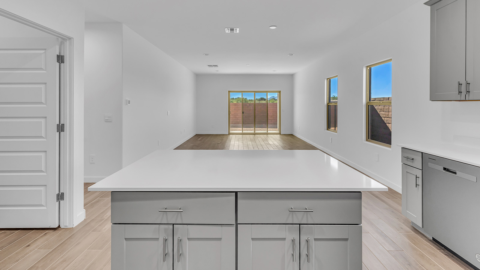 The Parker floor plan is one of the expansive new homes featured at The Oasis at Rocking K in Vail, Arizona. This vibrant community is nestled against the backdrop of the Rincon Mountains. The Parker stands out as a spacious single-story new home, offering 1,914 square feet of living space, making it the largest single-story floorplan available in this community.  The Parker is a reflection of elegance that defines The Oasis at Rocking K. The beautifully landscaped front yard, complete with an irrigation system, enhances the curb appeal, with a covered front porch.  Step into a well-planned layout that effortlessly balances functionality. The Parker features five bedrooms, including a private primary suite with a walk-in closet and en-suite bathroom. The additional bedrooms are thoughtfully situated to provide privacy and comfort, with easy access to two full bathrooms.  The heart of The Parker is the kitchen, which seamlessly connects to the dining room and great room. The kitchen is equipped with high-end finishes, including quartz countertops, shaker-style cabinets, and stainless-steel appliances. A generous pantry and plenty of cabinet space ensure that storage is never an issue.  The Parker includes a covered back patio, perfect for enjoying the tranquility of the surrounding landscape. Inside, the home features durable wood-look tile flooring in the main living areas, adding warmth and elegance to the space.  The Parker comes equipped with the Home is Connected® Smart Home package. This includes a smart thermostat, video doorbell, keyless entry, and more. Additionally, the home meets DOE Zero Energy Ready Home standards, with features like spray foam insulation and tankless water heaters, ensuring long-term savings and a reduced environmental footprint.  Living in The Oasis at Rocking K means enjoying a community rich in amenities. Whether you’re seeking a peaceful retreat or an active lifestyle, The Parker at The Oasis at Rocking K offers the perfect home base.