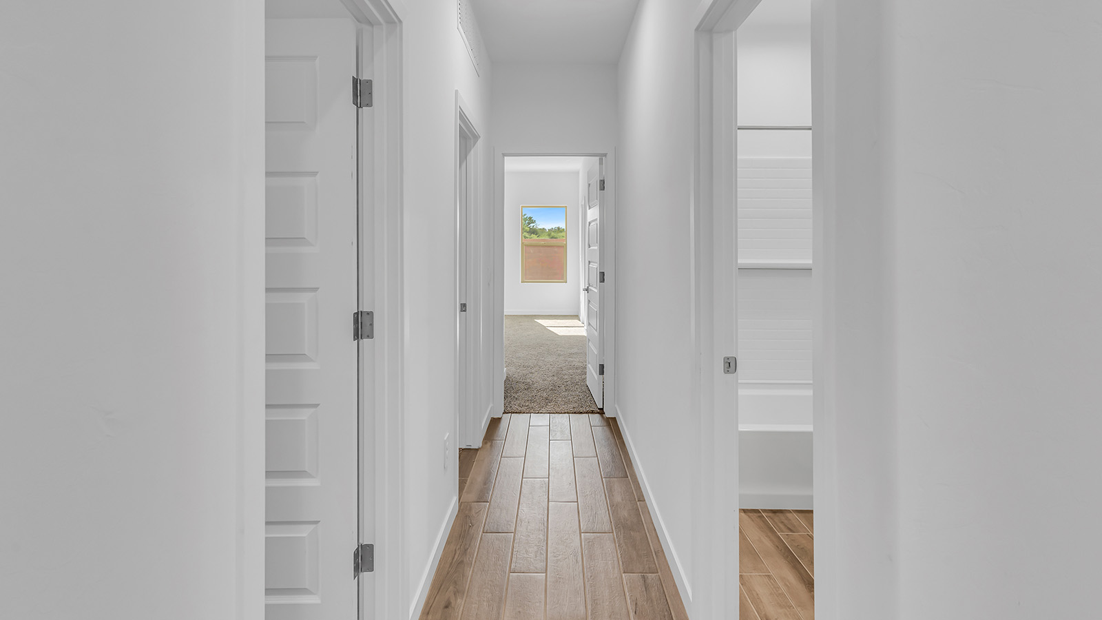 The Parker floor plan is one of the expansive new homes featured at The Oasis at Rocking K in Vail, Arizona. This vibrant community is nestled against the backdrop of the Rincon Mountains. The Parker stands out as a spacious single-story new home, offering 1,914 square feet of living space, making it the largest single-story floorplan available in this community.  The Parker is a reflection of elegance that defines The Oasis at Rocking K. The beautifully landscaped front yard, complete with an irrigation system, enhances the curb appeal, with a covered front porch.  Step into a well-planned layout that effortlessly balances functionality. The Parker features five bedrooms, including a private primary suite with a walk-in closet and en-suite bathroom. The additional bedrooms are thoughtfully situated to provide privacy and comfort, with easy access to two full bathrooms.  The heart of The Parker is the kitchen, which seamlessly connects to the dining room and great room. The kitchen is equipped with high-end finishes, including quartz countertops, shaker-style cabinets, and stainless-steel appliances. A generous pantry and plenty of cabinet space ensure that storage is never an issue.  The Parker includes a covered back patio, perfect for enjoying the tranquility of the surrounding landscape. Inside, the home features durable wood-look tile flooring in the main living areas, adding warmth and elegance to the space.  The Parker comes equipped with the Home is Connected® Smart Home package. This includes a smart thermostat, video doorbell, keyless entry, and more. Additionally, the home meets DOE Zero Energy Ready Home standards, with features like spray foam insulation and tankless water heaters, ensuring long-term savings and a reduced environmental footprint.  Living in The Oasis at Rocking K means enjoying a community rich in amenities. Whether you’re seeking a peaceful retreat or an active lifestyle, The Parker at The Oasis at Rocking K offers the perfect home base.