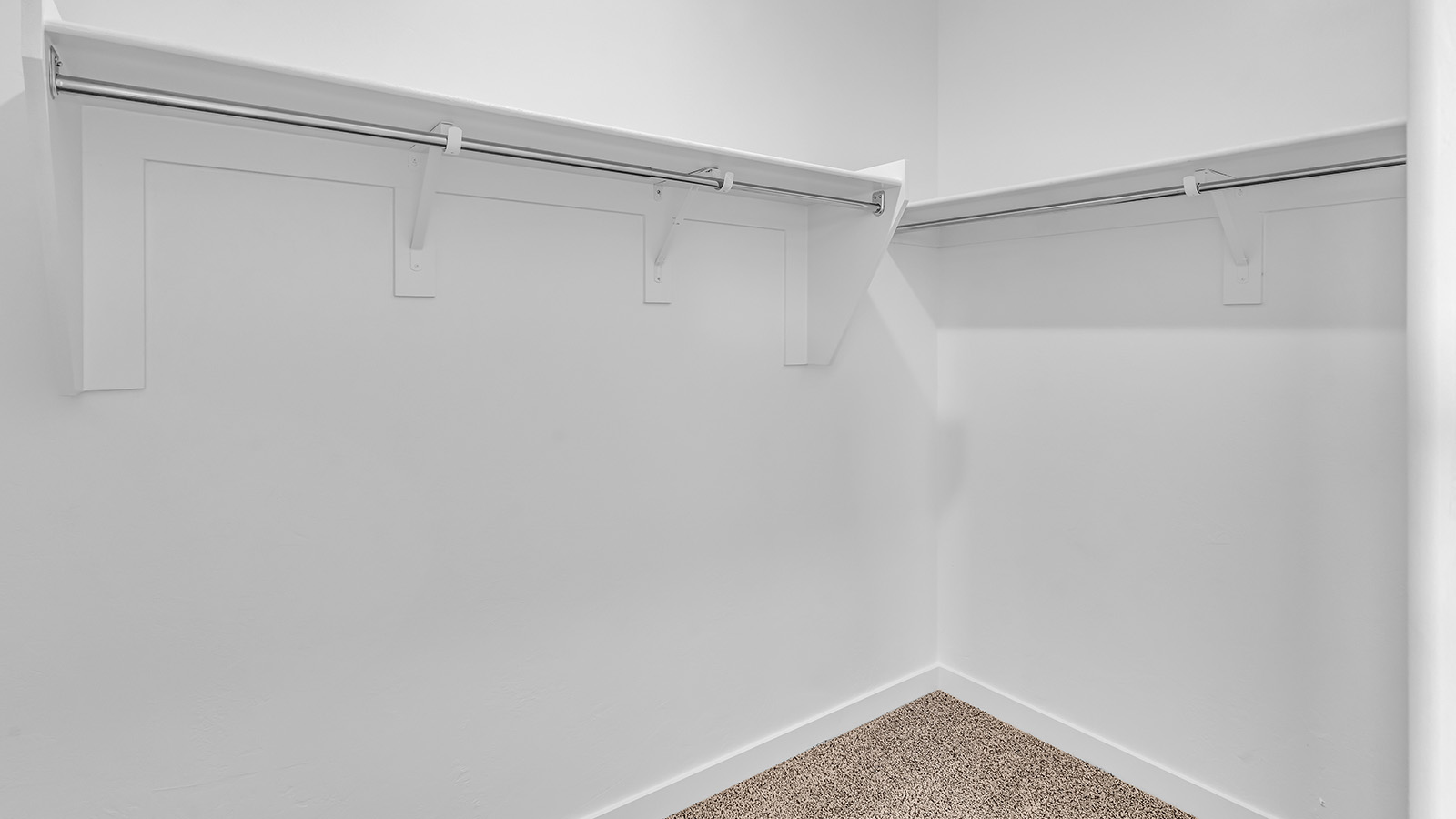 The Parker floor plan is one of the expansive new homes featured at The Oasis at Rocking K in Vail, Arizona. This vibrant community is nestled against the backdrop of the Rincon Mountains. The Parker stands out as a spacious single-story new home, offering 1,914 square feet of living space, making it the largest single-story floorplan available in this community.  The Parker is a reflection of elegance that defines The Oasis at Rocking K. The beautifully landscaped front yard, complete with an irrigation system, enhances the curb appeal, with a covered front porch.  Step into a well-planned layout that effortlessly balances functionality. The Parker features five bedrooms, including a private primary suite with a walk-in closet and en-suite bathroom. The additional bedrooms are thoughtfully situated to provide privacy and comfort, with easy access to two full bathrooms.  The heart of The Parker is the kitchen, which seamlessly connects to the dining room and great room. The kitchen is equipped with high-end finishes, including quartz countertops, shaker-style cabinets, and stainless-steel appliances. A generous pantry and plenty of cabinet space ensure that storage is never an issue.  The Parker includes a covered back patio, perfect for enjoying the tranquility of the surrounding landscape. Inside, the home features durable wood-look tile flooring in the main living areas, adding warmth and elegance to the space.  The Parker comes equipped with the Home is Connected® Smart Home package. This includes a smart thermostat, video doorbell, keyless entry, and more. Additionally, the home meets DOE Zero Energy Ready Home standards, with features like spray foam insulation and tankless water heaters, ensuring long-term savings and a reduced environmental footprint.  Living in The Oasis at Rocking K means enjoying a community rich in amenities. Whether you’re seeking a peaceful retreat or an active lifestyle, The Parker at The Oasis at Rocking K offers the perfect home base.