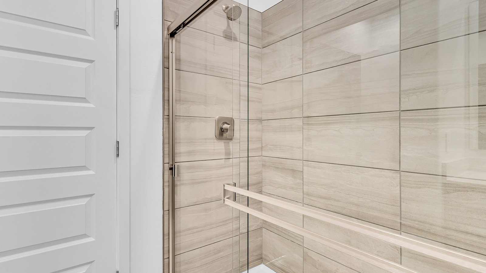 The Parker floor plan is one of the expansive new homes featured at The Oasis at Rocking K in Vail, Arizona. This vibrant community is nestled against the backdrop of the Rincon Mountains. The Parker stands out as a spacious single-story new home, offering 1,914 square feet of living space, making it the largest single-story floorplan available in this community.  The Parker is a reflection of elegance that defines The Oasis at Rocking K. The beautifully landscaped front yard, complete with an irrigation system, enhances the curb appeal, with a covered front porch.  Step into a well-planned layout that effortlessly balances functionality. The Parker features five bedrooms, including a private primary suite with a walk-in closet and en-suite bathroom. The additional bedrooms are thoughtfully situated to provide privacy and comfort, with easy access to two full bathrooms.  The heart of The Parker is the kitchen, which seamlessly connects to the dining room and great room. The kitchen is equipped with high-end finishes, including quartz countertops, shaker-style cabinets, and stainless-steel appliances. A generous pantry and plenty of cabinet space ensure that storage is never an issue.  The Parker includes a covered back patio, perfect for enjoying the tranquility of the surrounding landscape. Inside, the home features durable wood-look tile flooring in the main living areas, adding warmth and elegance to the space.  The Parker comes equipped with the Home is Connected® Smart Home package. This includes a smart thermostat, video doorbell, keyless entry, and more. Additionally, the home meets DOE Zero Energy Ready Home standards, with features like spray foam insulation and tankless water heaters, ensuring long-term savings and a reduced environmental footprint.  Living in The Oasis at Rocking K means enjoying a community rich in amenities. Whether you’re seeking a peaceful retreat or an active lifestyle, The Parker at The Oasis at Rocking K offers the perfect home base.