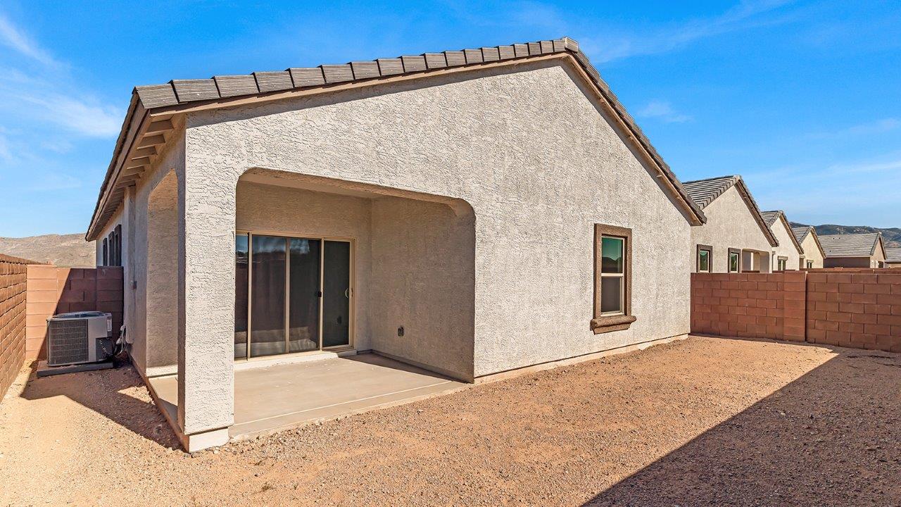 The Parker floor plan is one of the expansive new homes featured at The Oasis at Rocking K in Vail, Arizona. This vibrant community is nestled against the backdrop of the Rincon Mountains. The Parker stands out as a spacious single-story new home, offering 1,914 square feet of living space, making it the largest single-story floorplan available in this community.  The Parker is a reflection of elegance that defines The Oasis at Rocking K. The beautifully landscaped front yard, complete with an irrigation system, enhances the curb appeal, with a covered front porch.  Step into a well-planned layout that effortlessly balances functionality. The Parker features five bedrooms, including a private primary suite with a walk-in closet and en-suite bathroom. The additional bedrooms are thoughtfully situated to provide privacy and comfort, with easy access to two full bathrooms.  The heart of The Parker is the kitchen, which seamlessly connects to the dining room and great room. The kitchen is equipped with high-end finishes, including quartz countertops, shaker-style cabinets, and stainless-steel appliances. A generous pantry and plenty of cabinet space ensure that storage is never an issue.  The Parker includes a covered back patio, perfect for enjoying the tranquility of the surrounding landscape. Inside, the home features durable wood-look tile flooring in the main living areas, adding warmth and elegance to the space.  The Parker comes equipped with the Home is Connected® Smart Home package. This includes a smart thermostat, video doorbell, keyless entry, and more. Additionally, the home meets DOE Zero Energy Ready Home standards, with features like spray foam insulation and tankless water heaters, ensuring long-term savings and a reduced environmental footprint.  Living in The Oasis at Rocking K means enjoying a community rich in amenities. Whether you’re seeking a peaceful retreat or an active lifestyle, The Parker at The Oasis at Rocking K offers the perfect home base.