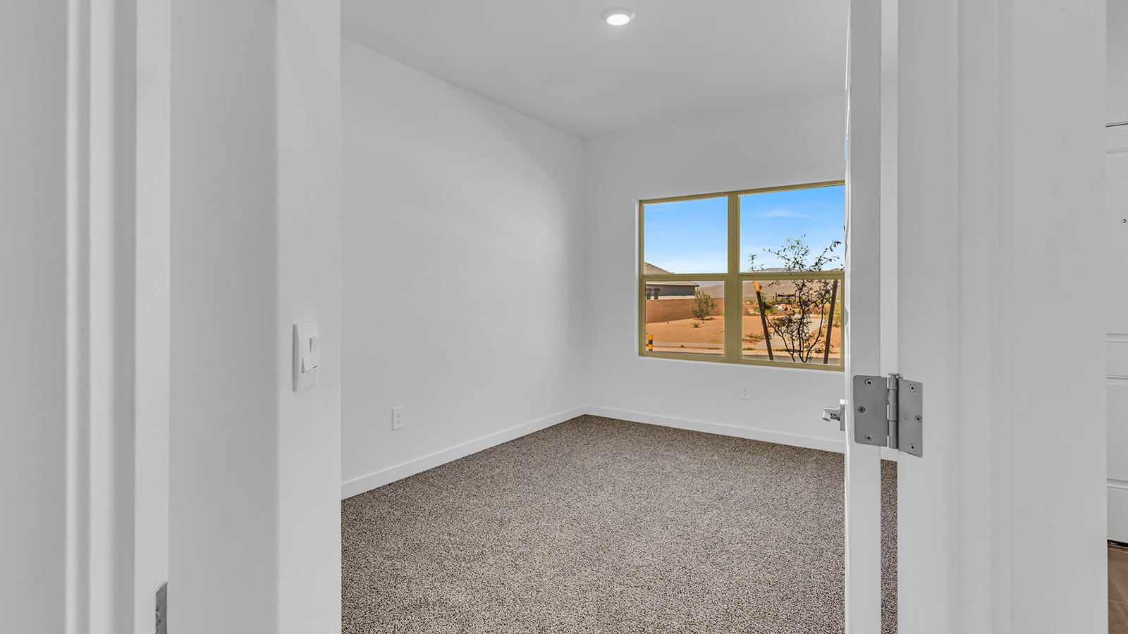 The Parker floor plan is one of the expansive new homes featured at The Oasis at Rocking K in Vail, Arizona. This vibrant community is nestled against the backdrop of the Rincon Mountains. The Parker stands out as a spacious single-story new home, offering 1,914 square feet of living space, making it the largest single-story floorplan available in this community.  The Parker is a reflection of elegance that defines The Oasis at Rocking K. The beautifully landscaped front yard, complete with an irrigation system, enhances the curb appeal, with a covered front porch.  Step into a well-planned layout that effortlessly balances functionality. The Parker features five bedrooms, including a private primary suite with a walk-in closet and en-suite bathroom. The additional bedrooms are thoughtfully situated to provide privacy and comfort, with easy access to two full bathrooms.  The heart of The Parker is the kitchen, which seamlessly connects to the dining room and great room. The kitchen is equipped with high-end finishes, including quartz countertops, shaker-style cabinets, and stainless-steel appliances. A generous pantry and plenty of cabinet space ensure that storage is never an issue.  The Parker includes a covered back patio, perfect for enjoying the tranquility of the surrounding landscape. Inside, the home features durable wood-look tile flooring in the main living areas, adding warmth and elegance to the space.  The Parker comes equipped with the Home is Connected® Smart Home package. This includes a smart thermostat, video doorbell, keyless entry, and more. Additionally, the home meets DOE Zero Energy Ready Home standards, with features like spray foam insulation and tankless water heaters, ensuring long-term savings and a reduced environmental footprint.  Living in The Oasis at Rocking K means enjoying a community rich in amenities. Whether you’re seeking a peaceful retreat or an active lifestyle, The Parker at The Oasis at Rocking K offers the perfect home base.