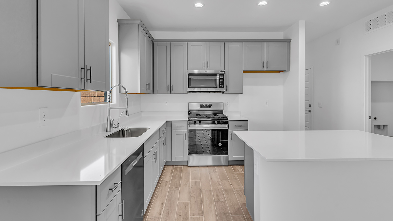 The Parker floor plan is one of the expansive new homes featured at The Oasis at Rocking K in Vail, Arizona. This vibrant community is nestled against the backdrop of the Rincon Mountains. The Parker stands out as a spacious single-story new home, offering 1,914 square feet of living space, making it the largest single-story floorplan available in this community.  The Parker is a reflection of elegance that defines The Oasis at Rocking K. The beautifully landscaped front yard, complete with an irrigation system, enhances the curb appeal, with a covered front porch.  Step into a well-planned layout that effortlessly balances functionality. The Parker features five bedrooms, including a private primary suite with a walk-in closet and en-suite bathroom. The additional bedrooms are thoughtfully situated to provide privacy and comfort, with easy access to two full bathrooms.  The heart of The Parker is the kitchen, which seamlessly connects to the dining room and great room. The kitchen is equipped with high-end finishes, including quartz countertops, shaker-style cabinets, and stainless-steel appliances. A generous pantry and plenty of cabinet space ensure that storage is never an issue.  The Parker includes a covered back patio, perfect for enjoying the tranquility of the surrounding landscape. Inside, the home features durable wood-look tile flooring in the main living areas, adding warmth and elegance to the space.  The Parker comes equipped with the Home is Connected® Smart Home package. This includes a smart thermostat, video doorbell, keyless entry, and more. Additionally, the home meets DOE Zero Energy Ready Home standards, with features like spray foam insulation and tankless water heaters, ensuring long-term savings and a reduced environmental footprint.  Living in The Oasis at Rocking K means enjoying a community rich in amenities. Whether you’re seeking a peaceful retreat or an active lifestyle, The Parker at The Oasis at Rocking K offers the perfect home base.