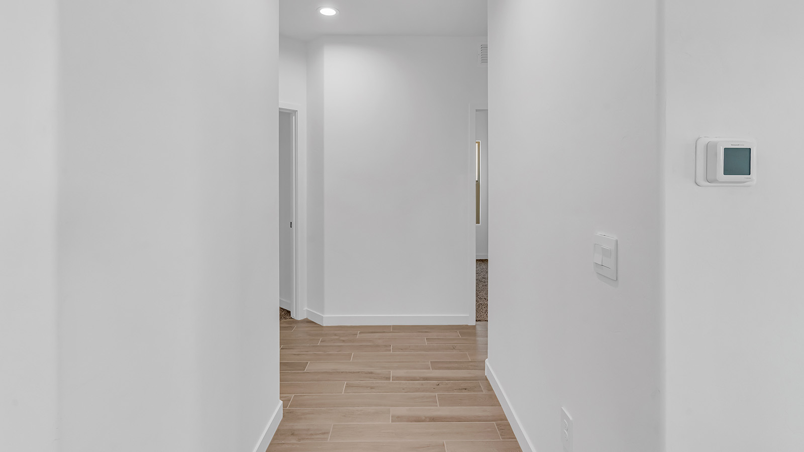 The Parker floor plan is one of the expansive new homes featured at The Oasis at Rocking K in Vail, Arizona. This vibrant community is nestled against the backdrop of the Rincon Mountains. The Parker stands out as a spacious single-story new home, offering 1,914 square feet of living space, making it the largest single-story floorplan available in this community.  The Parker is a reflection of elegance that defines The Oasis at Rocking K. The beautifully landscaped front yard, complete with an irrigation system, enhances the curb appeal, with a covered front porch.  Step into a well-planned layout that effortlessly balances functionality. The Parker features five bedrooms, including a private primary suite with a walk-in closet and en-suite bathroom. The additional bedrooms are thoughtfully situated to provide privacy and comfort, with easy access to two full bathrooms.  The heart of The Parker is the kitchen, which seamlessly connects to the dining room and great room. The kitchen is equipped with high-end finishes, including quartz countertops, shaker-style cabinets, and stainless-steel appliances. A generous pantry and plenty of cabinet space ensure that storage is never an issue.  The Parker includes a covered back patio, perfect for enjoying the tranquility of the surrounding landscape. Inside, the home features durable wood-look tile flooring in the main living areas, adding warmth and elegance to the space.  The Parker comes equipped with the Home is Connected® Smart Home package. This includes a smart thermostat, video doorbell, keyless entry, and more. Additionally, the home meets DOE Zero Energy Ready Home standards, with features like spray foam insulation and tankless water heaters, ensuring long-term savings and a reduced environmental footprint.  Living in The Oasis at Rocking K means enjoying a community rich in amenities. Whether you’re seeking a peaceful retreat or an active lifestyle, The Parker at The Oasis at Rocking K offers the perfect home base.