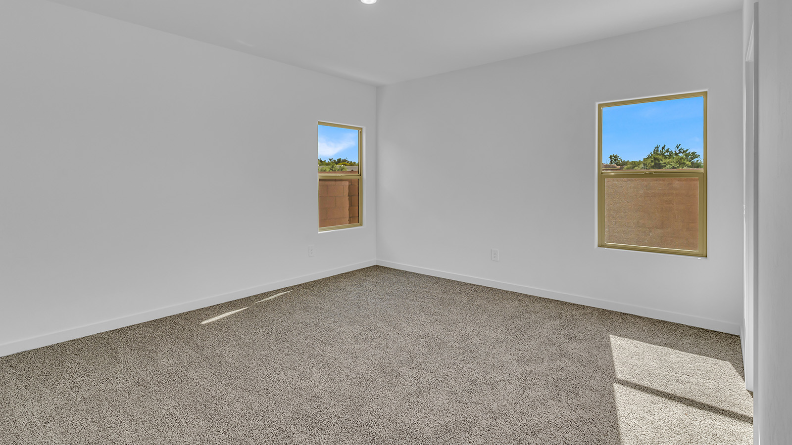 The Parker floor plan is one of the expansive new homes featured at The Oasis at Rocking K in Vail, Arizona. This vibrant community is nestled against the backdrop of the Rincon Mountains. The Parker stands out as a spacious single-story new home, offering 1,914 square feet of living space, making it the largest single-story floorplan available in this community.  The Parker is a reflection of elegance that defines The Oasis at Rocking K. The beautifully landscaped front yard, complete with an irrigation system, enhances the curb appeal, with a covered front porch.  Step into a well-planned layout that effortlessly balances functionality. The Parker features five bedrooms, including a private primary suite with a walk-in closet and en-suite bathroom. The additional bedrooms are thoughtfully situated to provide privacy and comfort, with easy access to two full bathrooms.  The heart of The Parker is the kitchen, which seamlessly connects to the dining room and great room. The kitchen is equipped with high-end finishes, including quartz countertops, shaker-style cabinets, and stainless-steel appliances. A generous pantry and plenty of cabinet space ensure that storage is never an issue.  The Parker includes a covered back patio, perfect for enjoying the tranquility of the surrounding landscape. Inside, the home features durable wood-look tile flooring in the main living areas, adding warmth and elegance to the space.  The Parker comes equipped with the Home is Connected® Smart Home package. This includes a smart thermostat, video doorbell, keyless entry, and more. Additionally, the home meets DOE Zero Energy Ready Home standards, with features like spray foam insulation and tankless water heaters, ensuring long-term savings and a reduced environmental footprint.  Living in The Oasis at Rocking K means enjoying a community rich in amenities. Whether you’re seeking a peaceful retreat or an active lifestyle, The Parker at The Oasis at Rocking K offers the perfect home base.