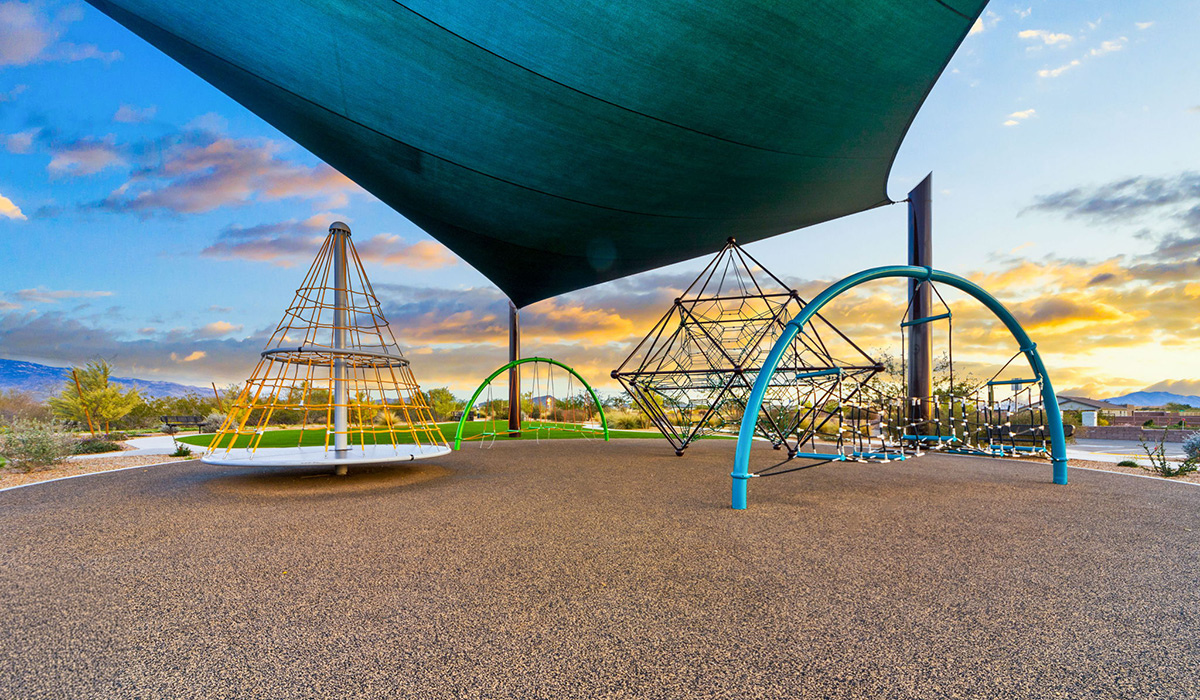 The Parker floor plan is one of the expansive new homes featured at The Oasis at Rocking K in Vail, Arizona. This vibrant community is nestled against the backdrop of the Rincon Mountains. The Parker stands out as a spacious single-story new home, offering 1,914 square feet of living space, making it the largest single-story floorplan available in this community.  The Parker is a reflection of elegance that defines The Oasis at Rocking K. The beautifully landscaped front yard, complete with an irrigation system, enhances the curb appeal, with a covered front porch.  Step into a well-planned layout that effortlessly balances functionality. The Parker features five bedrooms, including a private primary suite with a walk-in closet and en-suite bathroom. The additional bedrooms are thoughtfully situated to provide privacy and comfort, with easy access to two full bathrooms.  The heart of The Parker is the kitchen, which seamlessly connects to the dining room and great room. The kitchen is equipped with high-end finishes, including quartz countertops, shaker-style cabinets, and stainless-steel appliances. A generous pantry and plenty of cabinet space ensure that storage is never an issue.  The Parker includes a covered back patio, perfect for enjoying the tranquility of the surrounding landscape. Inside, the home features durable wood-look tile flooring in the main living areas, adding warmth and elegance to the space.  The Parker comes equipped with the Home is Connected® Smart Home package. This includes a smart thermostat, video doorbell, keyless entry, and more. Additionally, the home meets DOE Zero Energy Ready Home standards, with features like spray foam insulation and tankless water heaters, ensuring long-term savings and a reduced environmental footprint.  Living in The Oasis at Rocking K means enjoying a community rich in amenities. Whether you’re seeking a peaceful retreat or an active lifestyle, The Parker at The Oasis at Rocking K offers the perfect home base.