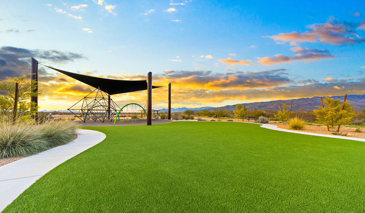 The Parker floor plan is one of the expansive new homes featured at The Oasis at Rocking K in Vail, Arizona. This vibrant community is nestled against the backdrop of the Rincon Mountains. The Parker stands out as a spacious single-story new home, offering 1,914 square feet of living space, making it the largest single-story floorplan available in this community.  The Parker is a reflection of elegance that defines The Oasis at Rocking K. The beautifully landscaped front yard, complete with an irrigation system, enhances the curb appeal, with a covered front porch.  Step into a well-planned layout that effortlessly balances functionality. The Parker features five bedrooms, including a private primary suite with a walk-in closet and en-suite bathroom. The additional bedrooms are thoughtfully situated to provide privacy and comfort, with easy access to two full bathrooms.  The heart of The Parker is the kitchen, which seamlessly connects to the dining room and great room. The kitchen is equipped with high-end finishes, including quartz countertops, shaker-style cabinets, and stainless-steel appliances. A generous pantry and plenty of cabinet space ensure that storage is never an issue.  The Parker includes a covered back patio, perfect for enjoying the tranquility of the surrounding landscape. Inside, the home features durable wood-look tile flooring in the main living areas, adding warmth and elegance to the space.  The Parker comes equipped with the Home is Connected® Smart Home package. This includes a smart thermostat, video doorbell, keyless entry, and more. Additionally, the home meets DOE Zero Energy Ready Home standards, with features like spray foam insulation and tankless water heaters, ensuring long-term savings and a reduced environmental footprint.  Living in The Oasis at Rocking K means enjoying a community rich in amenities. Whether you’re seeking a peaceful retreat or an active lifestyle, The Parker at The Oasis at Rocking K offers the perfect home base.