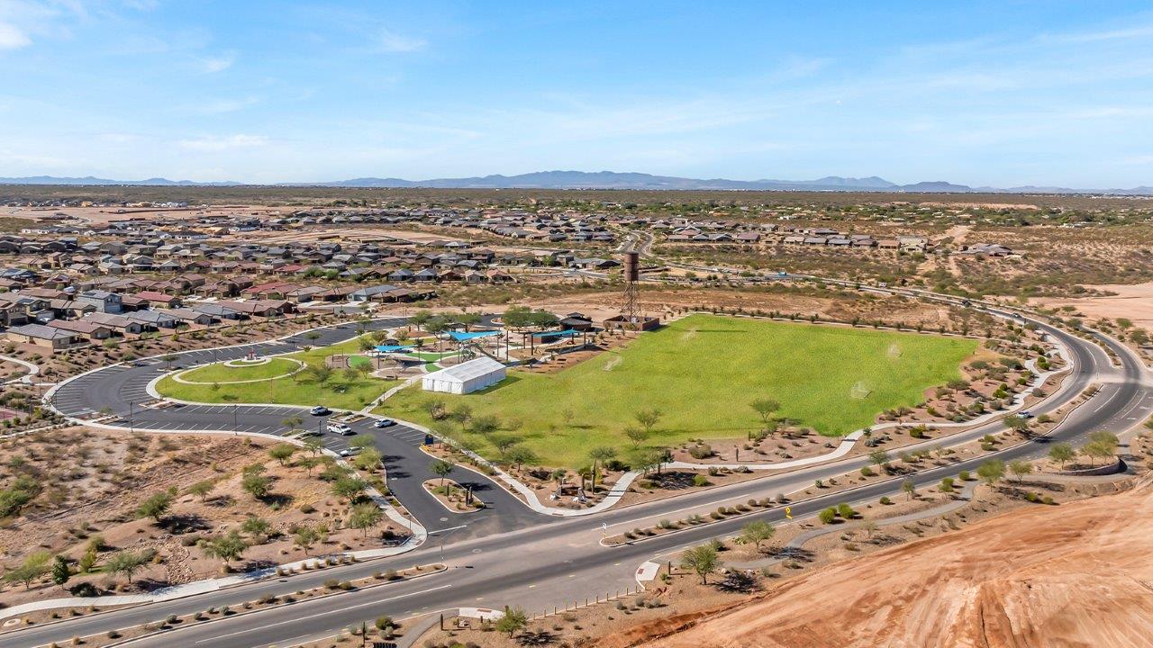 The Parker floor plan is one of the expansive new homes featured at The Oasis at Rocking K in Vail, Arizona. This vibrant community is nestled against the backdrop of the Rincon Mountains. The Parker stands out as a spacious single-story new home, offering 1,914 square feet of living space, making it the largest single-story floorplan available in this community.  The Parker is a reflection of elegance that defines The Oasis at Rocking K. The beautifully landscaped front yard, complete with an irrigation system, enhances the curb appeal, with a covered front porch.  Step into a well-planned layout that effortlessly balances functionality. The Parker features five bedrooms, including a private primary suite with a walk-in closet and en-suite bathroom. The additional bedrooms are thoughtfully situated to provide privacy and comfort, with easy access to two full bathrooms.  The heart of The Parker is the kitchen, which seamlessly connects to the dining room and great room. The kitchen is equipped with high-end finishes, including quartz countertops, shaker-style cabinets, and stainless-steel appliances. A generous pantry and plenty of cabinet space ensure that storage is never an issue.  The Parker includes a covered back patio, perfect for enjoying the tranquility of the surrounding landscape. Inside, the home features durable wood-look tile flooring in the main living areas, adding warmth and elegance to the space.  The Parker comes equipped with the Home is Connected® Smart Home package. This includes a smart thermostat, video doorbell, keyless entry, and more. Additionally, the home meets DOE Zero Energy Ready Home standards, with features like spray foam insulation and tankless water heaters, ensuring long-term savings and a reduced environmental footprint.  Living in The Oasis at Rocking K means enjoying a community rich in amenities. Whether you’re seeking a peaceful retreat or an active lifestyle, The Parker at The Oasis at Rocking K offers the perfect home base.