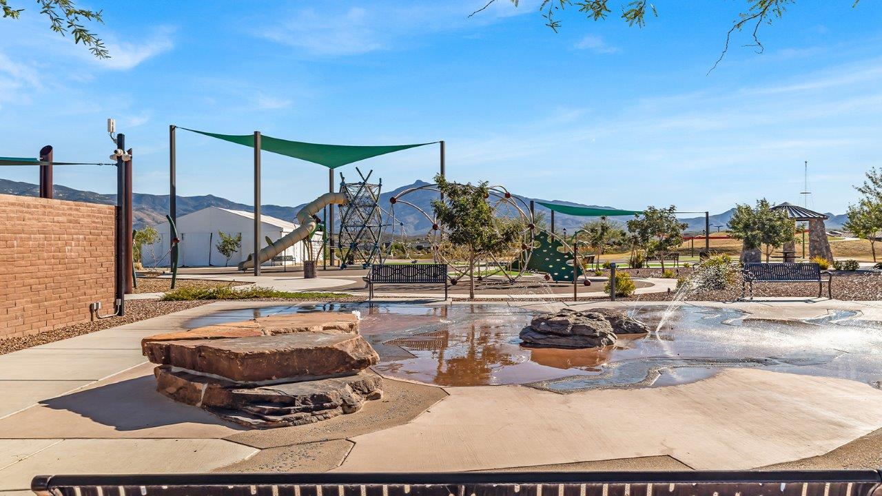 The Parker floor plan is one of the expansive new homes featured at The Oasis at Rocking K in Vail, Arizona. This vibrant community is nestled against the backdrop of the Rincon Mountains. The Parker stands out as a spacious single-story new home, offering 1,914 square feet of living space, making it the largest single-story floorplan available in this community.  The Parker is a reflection of elegance that defines The Oasis at Rocking K. The beautifully landscaped front yard, complete with an irrigation system, enhances the curb appeal, with a covered front porch.  Step into a well-planned layout that effortlessly balances functionality. The Parker features five bedrooms, including a private primary suite with a walk-in closet and en-suite bathroom. The additional bedrooms are thoughtfully situated to provide privacy and comfort, with easy access to two full bathrooms.  The heart of The Parker is the kitchen, which seamlessly connects to the dining room and great room. The kitchen is equipped with high-end finishes, including quartz countertops, shaker-style cabinets, and stainless-steel appliances. A generous pantry and plenty of cabinet space ensure that storage is never an issue.  The Parker includes a covered back patio, perfect for enjoying the tranquility of the surrounding landscape. Inside, the home features durable wood-look tile flooring in the main living areas, adding warmth and elegance to the space.  The Parker comes equipped with the Home is Connected® Smart Home package. This includes a smart thermostat, video doorbell, keyless entry, and more. Additionally, the home meets DOE Zero Energy Ready Home standards, with features like spray foam insulation and tankless water heaters, ensuring long-term savings and a reduced environmental footprint.  Living in The Oasis at Rocking K means enjoying a community rich in amenities. Whether you’re seeking a peaceful retreat or an active lifestyle, The Parker at The Oasis at Rocking K offers the perfect home base.