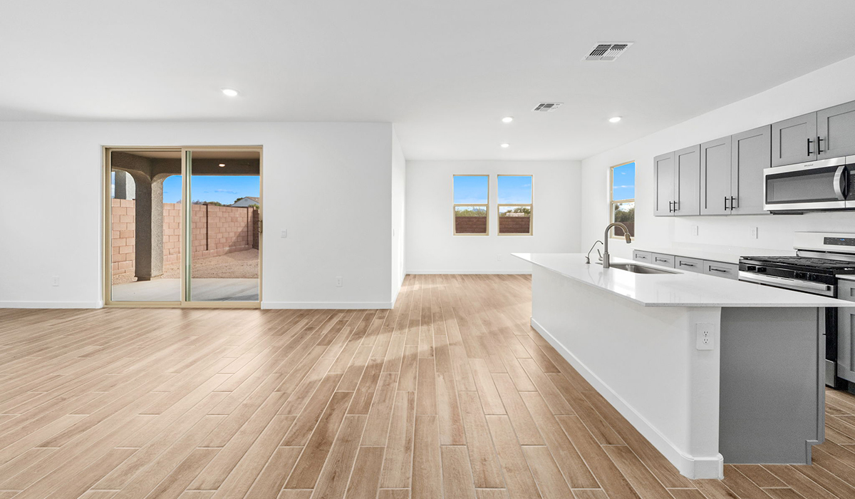 The Juniper at The Oasis at Rocking K presents an exceptional living experience that blends comfort and style within its thoughtfully crafted 2,439 square feet. This two-story, four-bedroom, two full bathroom, and one half-bathroom home offers space and room to grow. This home features a three-car tandem garage. The Juniper home is designed to cater to a variety of lifestyle needs, offering both privacy and open spaces that encourage togetherness. As you step into the welcoming entryway, you're led into a spacious great room that seamlessly connects with the dining room and kitchen, creating a perfect setting for daily living and entertaining. The kitchen is a true culinary delight, featuring elegant countertops, shaker-style cabinets, and a modern layout that includes a pantry for additional storage.  Welcome to The Juniper at Oasis at Rocking K, a premier D.R. Horton new home community nestled in the picturesque landscapes of Vail, Arizona, where new homes blend seamlessly with the breathtaking surroundings of the Rincon Mountains. Experience the perfect balance of tranquility and modern convenience in this master-planned neighborhood, designed to offer a lifestyle that caters to families, nature enthusiasts, and anyone seeking a peaceful yet connected community.  Each home in The Oasis at Rocking K is equipped with D.R. Horton’s Home is Connected® Smart Home package, which includes a smart thermostat, video doorbell, keyless entry, Wi-Fi-enabled garage door opener, and Deako light switches. Additionally, these homes meet the stringent DOE Zero Energy Ready Home standards, making them not only comfortable and modern but also exceptionally energy efficient. With features like spray foam insulation, tankless water heaters and LED lighting, these homes are designed to reduce your environmental footprint and provide long-term savings on energy costs.  Living at Rocking K means being part of a vibrant, family-oriented community with a strong sense of connection among residents. The Oasis at Rocking K offers a variety of amenities, including ramadas, picnic tables, and grassy areas perfect for gatherings. Residents also have access to the greater Rocking K master-planned neighborhood amenities, such as a splashpad, large event lawn, walking paths, multipurpose fields, basketball and pickleball courts, and an innovative playground with a zip-line and jungle gym. The new K-8 school, set to open in 2025, is just one of the many features that make Rocking K ideal for families.  Life at Rocking K is further enriched by a lively calendar of lifestyle events, thoughtfully organized by the Rocking K Homeowners Association. These events are a cornerstone of community life, fostering a strong sense of connection among residents. Whether you’re looking to enjoy a quiet evening star gazing in the park or engage in fun activities with neighbors, there’s always something happening. The quarterly lifestyle calendar is packed with regular and seasonal events, including movie nights in the park, sports and summer camps for kids, and wine tasting events for adults. Families can join hiking groups, participate in trivia nights, or enjoy the various holiday celebrations. The community comes alive during the holidays with loads of themed events, arts and crafts fairs, and car shows. Rocking K’s commitment to providing a dynamic and engaging environment ensures that there’s always an opportunity to make memories and build lasting friendships right in your neighborhood.  Residents of Rocking K benefit from easy access to I-10, making commutes to Tucson and surrounding areas a breeze. The community is close to major employers such as Davis-Monthan Air Force Base, Raytheon, and the University of Arizona, as well as top-notch healthcare facilities like TMC Rincon and Northwest Hospital East. The nearby Houghton Town Center and Houghton Rd. business corridor offer convenient shopping, dining, and services.  For outdoor enthusiasts, Rocking K is surrounded by natural beauty and recreational opportunities. Explore the hiking and biking trails at Colossal Cave Mountain Park, Saguaro National Park East, and the Arizona Trail. Enjoy golfing at Del Lago Golf Course or take a short drive to Sonoita for a day trip to Arizona’s Wine Country. Whether it’s hiking, camping, or simply taking in the stunning views, Rocking K is your gateway to the great outdoors. With 360-degree mountain views, calm and quiet evenings, and a location that’s close to everything you need, Rocking K is truly a community where you can thrive. Experience the best of Arizona living at The Oasis at Rocking K, where your new home awaits in a community that offers everything you need for a fulfilling lifestyle.  *Images shown are for reference only. They depict the Juniper model home and include virtual staging and may not represent the actual home.