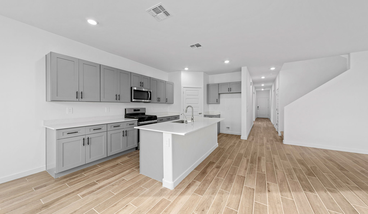 The Juniper at The Oasis at Rocking K presents an exceptional living experience that blends comfort and style within its thoughtfully crafted 2,439 square feet. This two-story, four-bedroom, two full bathroom, and one half-bathroom home offers space and room to grow. This home features a three-car tandem garage. The Juniper home is designed to cater to a variety of lifestyle needs, offering both privacy and open spaces that encourage togetherness. As you step into the welcoming entryway, you're led into a spacious great room that seamlessly connects with the dining room and kitchen, creating a perfect setting for daily living and entertaining. The kitchen is a true culinary delight, featuring elegant countertops, shaker-style cabinets, and a modern layout that includes a pantry for additional storage.  Welcome to The Juniper at Oasis at Rocking K, a premier D.R. Horton new home community nestled in the picturesque landscapes of Vail, Arizona, where new homes blend seamlessly with the breathtaking surroundings of the Rincon Mountains. Experience the perfect balance of tranquility and modern convenience in this master-planned neighborhood, designed to offer a lifestyle that caters to families, nature enthusiasts, and anyone seeking a peaceful yet connected community.  Each home in The Oasis at Rocking K is equipped with D.R. Horton’s Home is Connected® Smart Home package, which includes a smart thermostat, video doorbell, keyless entry, Wi-Fi-enabled garage door opener, and Deako light switches. Additionally, these homes meet the stringent DOE Zero Energy Ready Home standards, making them not only comfortable and modern but also exceptionally energy efficient. With features like spray foam insulation, tankless water heaters and LED lighting, these homes are designed to reduce your environmental footprint and provide long-term savings on energy costs.  Living at Rocking K means being part of a vibrant, family-oriented community with a strong sense of connection among residents. The Oasis at Rocking K offers a variety of amenities, including ramadas, picnic tables, and grassy areas perfect for gatherings. Residents also have access to the greater Rocking K master-planned neighborhood amenities, such as a splashpad, large event lawn, walking paths, multipurpose fields, basketball and pickleball courts, and an innovative playground with a zip-line and jungle gym. The new K-8 school, set to open in 2025, is just one of the many features that make Rocking K ideal for families.  Life at Rocking K is further enriched by a lively calendar of lifestyle events, thoughtfully organized by the Rocking K Homeowners Association. These events are a cornerstone of community life, fostering a strong sense of connection among residents. Whether you’re looking to enjoy a quiet evening star gazing in the park or engage in fun activities with neighbors, there’s always something happening. The quarterly lifestyle calendar is packed with regular and seasonal events, including movie nights in the park, sports and summer camps for kids, and wine tasting events for adults. Families can join hiking groups, participate in trivia nights, or enjoy the various holiday celebrations. The community comes alive during the holidays with loads of themed events, arts and crafts fairs, and car shows. Rocking K’s commitment to providing a dynamic and engaging environment ensures that there’s always an opportunity to make memories and build lasting friendships right in your neighborhood.  Residents of Rocking K benefit from easy access to I-10, making commutes to Tucson and surrounding areas a breeze. The community is close to major employers such as Davis-Monthan Air Force Base, Raytheon, and the University of Arizona, as well as top-notch healthcare facilities like TMC Rincon and Northwest Hospital East. The nearby Houghton Town Center and Houghton Rd. business corridor offer convenient shopping, dining, and services.  For outdoor enthusiasts, Rocking K is surrounded by natural beauty and recreational opportunities. Explore the hiking and biking trails at Colossal Cave Mountain Park, Saguaro National Park East, and the Arizona Trail. Enjoy golfing at Del Lago Golf Course or take a short drive to Sonoita for a day trip to Arizona’s Wine Country. Whether it’s hiking, camping, or simply taking in the stunning views, Rocking K is your gateway to the great outdoors. With 360-degree mountain views, calm and quiet evenings, and a location that’s close to everything you need, Rocking K is truly a community where you can thrive. Experience the best of Arizona living at The Oasis at Rocking K, where your new home awaits in a community that offers everything you need for a fulfilling lifestyle.  *Images shown are for reference only. They depict the Juniper model home and include virtual staging and may not represent the actual home.