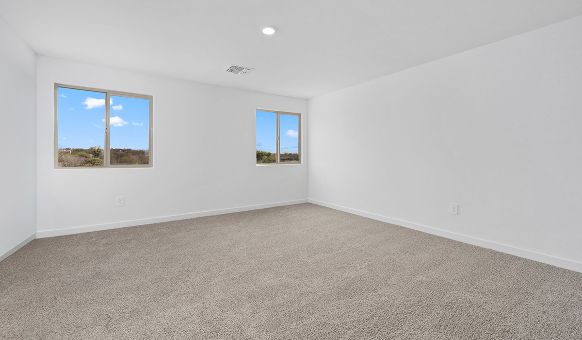 The Juniper at The Oasis at Rocking K presents an exceptional living experience that blends comfort and style within its thoughtfully crafted 2,439 square feet. This two-story, four-bedroom, two full bathroom, and one half-bathroom home offers space and room to grow. This home features a three-car tandem garage. The Juniper home is designed to cater to a variety of lifestyle needs, offering both privacy and open spaces that encourage togetherness. As you step into the welcoming entryway, you're led into a spacious great room that seamlessly connects with the dining room and kitchen, creating a perfect setting for daily living and entertaining. The kitchen is a true culinary delight, featuring elegant countertops, shaker-style cabinets, and a modern layout that includes a pantry for additional storage.  Welcome to The Juniper at Oasis at Rocking K, a premier D.R. Horton new home community nestled in the picturesque landscapes of Vail, Arizona, where new homes blend seamlessly with the breathtaking surroundings of the Rincon Mountains. Experience the perfect balance of tranquility and modern convenience in this master-planned neighborhood, designed to offer a lifestyle that caters to families, nature enthusiasts, and anyone seeking a peaceful yet connected community.  Each home in The Oasis at Rocking K is equipped with D.R. Horton’s Home is Connected® Smart Home package, which includes a smart thermostat, video doorbell, keyless entry, Wi-Fi-enabled garage door opener, and Deako light switches. Additionally, these homes meet the stringent DOE Zero Energy Ready Home standards, making them not only comfortable and modern but also exceptionally energy efficient. With features like spray foam insulation, tankless water heaters and LED lighting, these homes are designed to reduce your environmental footprint and provide long-term savings on energy costs.  Living at Rocking K means being part of a vibrant, family-oriented community with a strong sense of connection among residents. The Oasis at Rocking K offers a variety of amenities, including ramadas, picnic tables, and grassy areas perfect for gatherings. Residents also have access to the greater Rocking K master-planned neighborhood amenities, such as a splashpad, large event lawn, walking paths, multipurpose fields, basketball and pickleball courts, and an innovative playground with a zip-line and jungle gym. The new K-8 school, set to open in 2025, is just one of the many features that make Rocking K ideal for families.  Life at Rocking K is further enriched by a lively calendar of lifestyle events, thoughtfully organized by the Rocking K Homeowners Association. These events are a cornerstone of community life, fostering a strong sense of connection among residents. Whether you’re looking to enjoy a quiet evening star gazing in the park or engage in fun activities with neighbors, there’s always something happening. The quarterly lifestyle calendar is packed with regular and seasonal events, including movie nights in the park, sports and summer camps for kids, and wine tasting events for adults. Families can join hiking groups, participate in trivia nights, or enjoy the various holiday celebrations. The community comes alive during the holidays with loads of themed events, arts and crafts fairs, and car shows. Rocking K’s commitment to providing a dynamic and engaging environment ensures that there’s always an opportunity to make memories and build lasting friendships right in your neighborhood.  Residents of Rocking K benefit from easy access to I-10, making commutes to Tucson and surrounding areas a breeze. The community is close to major employers such as Davis-Monthan Air Force Base, Raytheon, and the University of Arizona, as well as top-notch healthcare facilities like TMC Rincon and Northwest Hospital East. The nearby Houghton Town Center and Houghton Rd. business corridor offer convenient shopping, dining, and services.  For outdoor enthusiasts, Rocking K is surrounded by natural beauty and recreational opportunities. Explore the hiking and biking trails at Colossal Cave Mountain Park, Saguaro National Park East, and the Arizona Trail. Enjoy golfing at Del Lago Golf Course or take a short drive to Sonoita for a day trip to Arizona’s Wine Country. Whether it’s hiking, camping, or simply taking in the stunning views, Rocking K is your gateway to the great outdoors. With 360-degree mountain views, calm and quiet evenings, and a location that’s close to everything you need, Rocking K is truly a community where you can thrive. Experience the best of Arizona living at The Oasis at Rocking K, where your new home awaits in a community that offers everything you need for a fulfilling lifestyle.  *Images shown are for reference only. They depict the Juniper model home and include virtual staging and may not represent the actual home.