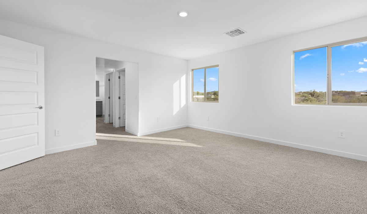 The Juniper at The Oasis at Rocking K presents an exceptional living experience that blends comfort and style within its thoughtfully crafted 2,439 square feet. This two-story, four-bedroom, two full bathroom, and one half-bathroom home offers space and room to grow. This home features a three-car tandem garage. The Juniper home is designed to cater to a variety of lifestyle needs, offering both privacy and open spaces that encourage togetherness. As you step into the welcoming entryway, you're led into a spacious great room that seamlessly connects with the dining room and kitchen, creating a perfect setting for daily living and entertaining. The kitchen is a true culinary delight, featuring elegant countertops, shaker-style cabinets, and a modern layout that includes a pantry for additional storage.  Welcome to The Juniper at Oasis at Rocking K, a premier D.R. Horton new home community nestled in the picturesque landscapes of Vail, Arizona, where new homes blend seamlessly with the breathtaking surroundings of the Rincon Mountains. Experience the perfect balance of tranquility and modern convenience in this master-planned neighborhood, designed to offer a lifestyle that caters to families, nature enthusiasts, and anyone seeking a peaceful yet connected community.  Each home in The Oasis at Rocking K is equipped with D.R. Horton’s Home is Connected® Smart Home package, which includes a smart thermostat, video doorbell, keyless entry, Wi-Fi-enabled garage door opener, and Deako light switches. Additionally, these homes meet the stringent DOE Zero Energy Ready Home standards, making them not only comfortable and modern but also exceptionally energy efficient. With features like spray foam insulation, tankless water heaters and LED lighting, these homes are designed to reduce your environmental footprint and provide long-term savings on energy costs.  Living at Rocking K means being part of a vibrant, family-oriented community with a strong sense of connection among residents. The Oasis at Rocking K offers a variety of amenities, including ramadas, picnic tables, and grassy areas perfect for gatherings. Residents also have access to the greater Rocking K master-planned neighborhood amenities, such as a splashpad, large event lawn, walking paths, multipurpose fields, basketball and pickleball courts, and an innovative playground with a zip-line and jungle gym. The new K-8 school, set to open in 2025, is just one of the many features that make Rocking K ideal for families.  Life at Rocking K is further enriched by a lively calendar of lifestyle events, thoughtfully organized by the Rocking K Homeowners Association. These events are a cornerstone of community life, fostering a strong sense of connection among residents. Whether you’re looking to enjoy a quiet evening star gazing in the park or engage in fun activities with neighbors, there’s always something happening. The quarterly lifestyle calendar is packed with regular and seasonal events, including movie nights in the park, sports and summer camps for kids, and wine tasting events for adults. Families can join hiking groups, participate in trivia nights, or enjoy the various holiday celebrations. The community comes alive during the holidays with loads of themed events, arts and crafts fairs, and car shows. Rocking K’s commitment to providing a dynamic and engaging environment ensures that there’s always an opportunity to make memories and build lasting friendships right in your neighborhood.  Residents of Rocking K benefit from easy access to I-10, making commutes to Tucson and surrounding areas a breeze. The community is close to major employers such as Davis-Monthan Air Force Base, Raytheon, and the University of Arizona, as well as top-notch healthcare facilities like TMC Rincon and Northwest Hospital East. The nearby Houghton Town Center and Houghton Rd. business corridor offer convenient shopping, dining, and services.  For outdoor enthusiasts, Rocking K is surrounded by natural beauty and recreational opportunities. Explore the hiking and biking trails at Colossal Cave Mountain Park, Saguaro National Park East, and the Arizona Trail. Enjoy golfing at Del Lago Golf Course or take a short drive to Sonoita for a day trip to Arizona’s Wine Country. Whether it’s hiking, camping, or simply taking in the stunning views, Rocking K is your gateway to the great outdoors. With 360-degree mountain views, calm and quiet evenings, and a location that’s close to everything you need, Rocking K is truly a community where you can thrive. Experience the best of Arizona living at The Oasis at Rocking K, where your new home awaits in a community that offers everything you need for a fulfilling lifestyle.  *Images shown are for reference only. They depict the Juniper model home and include virtual staging and may not represent the actual home.