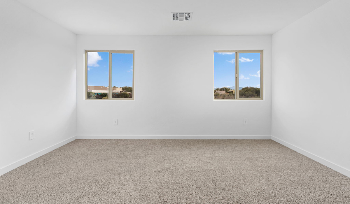 The Juniper at The Oasis at Rocking K presents an exceptional living experience that blends comfort and style within its thoughtfully crafted 2,439 square feet. This two-story, four-bedroom, two full bathroom, and one half-bathroom home offers space and room to grow. This home features a three-car tandem garage. The Juniper home is designed to cater to a variety of lifestyle needs, offering both privacy and open spaces that encourage togetherness. As you step into the welcoming entryway, you're led into a spacious great room that seamlessly connects with the dining room and kitchen, creating a perfect setting for daily living and entertaining. The kitchen is a true culinary delight, featuring elegant countertops, shaker-style cabinets, and a modern layout that includes a pantry for additional storage.  Welcome to The Juniper at Oasis at Rocking K, a premier D.R. Horton new home community nestled in the picturesque landscapes of Vail, Arizona, where new homes blend seamlessly with the breathtaking surroundings of the Rincon Mountains. Experience the perfect balance of tranquility and modern convenience in this master-planned neighborhood, designed to offer a lifestyle that caters to families, nature enthusiasts, and anyone seeking a peaceful yet connected community.  Each home in The Oasis at Rocking K is equipped with D.R. Horton’s Home is Connected® Smart Home package, which includes a smart thermostat, video doorbell, keyless entry, Wi-Fi-enabled garage door opener, and Deako light switches. Additionally, these homes meet the stringent DOE Zero Energy Ready Home standards, making them not only comfortable and modern but also exceptionally energy efficient. With features like spray foam insulation, tankless water heaters and LED lighting, these homes are designed to reduce your environmental footprint and provide long-term savings on energy costs.  Living at Rocking K means being part of a vibrant, family-oriented community with a strong sense of connection among residents. The Oasis at Rocking K offers a variety of amenities, including ramadas, picnic tables, and grassy areas perfect for gatherings. Residents also have access to the greater Rocking K master-planned neighborhood amenities, such as a splashpad, large event lawn, walking paths, multipurpose fields, basketball and pickleball courts, and an innovative playground with a zip-line and jungle gym. The new K-8 school, set to open in 2025, is just one of the many features that make Rocking K ideal for families.  Life at Rocking K is further enriched by a lively calendar of lifestyle events, thoughtfully organized by the Rocking K Homeowners Association. These events are a cornerstone of community life, fostering a strong sense of connection among residents. Whether you’re looking to enjoy a quiet evening star gazing in the park or engage in fun activities with neighbors, there’s always something happening. The quarterly lifestyle calendar is packed with regular and seasonal events, including movie nights in the park, sports and summer camps for kids, and wine tasting events for adults. Families can join hiking groups, participate in trivia nights, or enjoy the various holiday celebrations. The community comes alive during the holidays with loads of themed events, arts and crafts fairs, and car shows. Rocking K’s commitment to providing a dynamic and engaging environment ensures that there’s always an opportunity to make memories and build lasting friendships right in your neighborhood.  Residents of Rocking K benefit from easy access to I-10, making commutes to Tucson and surrounding areas a breeze. The community is close to major employers such as Davis-Monthan Air Force Base, Raytheon, and the University of Arizona, as well as top-notch healthcare facilities like TMC Rincon and Northwest Hospital East. The nearby Houghton Town Center and Houghton Rd. business corridor offer convenient shopping, dining, and services.  For outdoor enthusiasts, Rocking K is surrounded by natural beauty and recreational opportunities. Explore the hiking and biking trails at Colossal Cave Mountain Park, Saguaro National Park East, and the Arizona Trail. Enjoy golfing at Del Lago Golf Course or take a short drive to Sonoita for a day trip to Arizona’s Wine Country. Whether it’s hiking, camping, or simply taking in the stunning views, Rocking K is your gateway to the great outdoors. With 360-degree mountain views, calm and quiet evenings, and a location that’s close to everything you need, Rocking K is truly a community where you can thrive. Experience the best of Arizona living at The Oasis at Rocking K, where your new home awaits in a community that offers everything you need for a fulfilling lifestyle.  *Images shown are for reference only. They depict the Juniper model home and include virtual staging and may not represent the actual home.