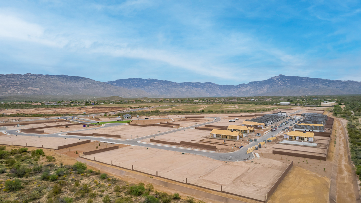 The Juniper at The Oasis at Rocking K presents an exceptional living experience that blends comfort and style within its thoughtfully crafted 2,439 square feet. This two-story, four-bedroom, two full bathroom, and one half-bathroom home offers space and room to grow. This home features a three-car tandem garage. The Juniper home is designed to cater to a variety of lifestyle needs, offering both privacy and open spaces that encourage togetherness. As you step into the welcoming entryway, you're led into a spacious great room that seamlessly connects with the dining room and kitchen, creating a perfect setting for daily living and entertaining. The kitchen is a true culinary delight, featuring elegant countertops, shaker-style cabinets, and a modern layout that includes a pantry for additional storage.  Welcome to The Juniper at Oasis at Rocking K, a premier D.R. Horton new home community nestled in the picturesque landscapes of Vail, Arizona, where new homes blend seamlessly with the breathtaking surroundings of the Rincon Mountains. Experience the perfect balance of tranquility and modern convenience in this master-planned neighborhood, designed to offer a lifestyle that caters to families, nature enthusiasts, and anyone seeking a peaceful yet connected community.  Each home in The Oasis at Rocking K is equipped with D.R. Horton’s Home is Connected® Smart Home package, which includes a smart thermostat, video doorbell, keyless entry, Wi-Fi-enabled garage door opener, and Deako light switches. Additionally, these homes meet the stringent DOE Zero Energy Ready Home standards, making them not only comfortable and modern but also exceptionally energy efficient. With features like spray foam insulation, tankless water heaters and LED lighting, these homes are designed to reduce your environmental footprint and provide long-term savings on energy costs.  Living at Rocking K means being part of a vibrant, family-oriented community with a strong sense of connection among residents. The Oasis at Rocking K offers a variety of amenities, including ramadas, picnic tables, and grassy areas perfect for gatherings. Residents also have access to the greater Rocking K master-planned neighborhood amenities, such as a splashpad, large event lawn, walking paths, multipurpose fields, basketball and pickleball courts, and an innovative playground with a zip-line and jungle gym. The new K-8 school, set to open in 2025, is just one of the many features that make Rocking K ideal for families.  Life at Rocking K is further enriched by a lively calendar of lifestyle events, thoughtfully organized by the Rocking K Homeowners Association. These events are a cornerstone of community life, fostering a strong sense of connection among residents. Whether you’re looking to enjoy a quiet evening star gazing in the park or engage in fun activities with neighbors, there’s always something happening. The quarterly lifestyle calendar is packed with regular and seasonal events, including movie nights in the park, sports and summer camps for kids, and wine tasting events for adults. Families can join hiking groups, participate in trivia nights, or enjoy the various holiday celebrations. The community comes alive during the holidays with loads of themed events, arts and crafts fairs, and car shows. Rocking K’s commitment to providing a dynamic and engaging environment ensures that there’s always an opportunity to make memories and build lasting friendships right in your neighborhood.  Residents of Rocking K benefit from easy access to I-10, making commutes to Tucson and surrounding areas a breeze. The community is close to major employers such as Davis-Monthan Air Force Base, Raytheon, and the University of Arizona, as well as top-notch healthcare facilities like TMC Rincon and Northwest Hospital East. The nearby Houghton Town Center and Houghton Rd. business corridor offer convenient shopping, dining, and services.  For outdoor enthusiasts, Rocking K is surrounded by natural beauty and recreational opportunities. Explore the hiking and biking trails at Colossal Cave Mountain Park, Saguaro National Park East, and the Arizona Trail. Enjoy golfing at Del Lago Golf Course or take a short drive to Sonoita for a day trip to Arizona’s Wine Country. Whether it’s hiking, camping, or simply taking in the stunning views, Rocking K is your gateway to the great outdoors. With 360-degree mountain views, calm and quiet evenings, and a location that’s close to everything you need, Rocking K is truly a community where you can thrive. Experience the best of Arizona living at The Oasis at Rocking K, where your new home awaits in a community that offers everything you need for a fulfilling lifestyle.